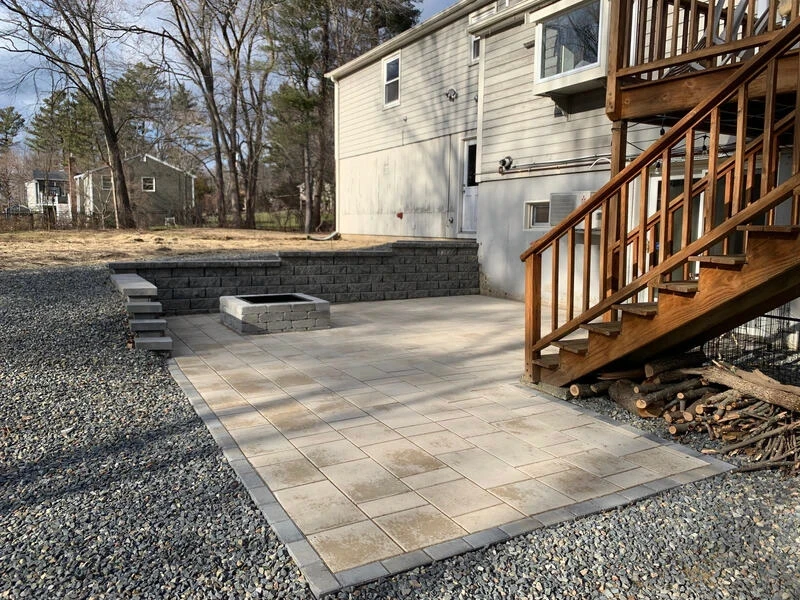 Price Landscape and Construction finished project at a a residential home of a stone patio and firepit