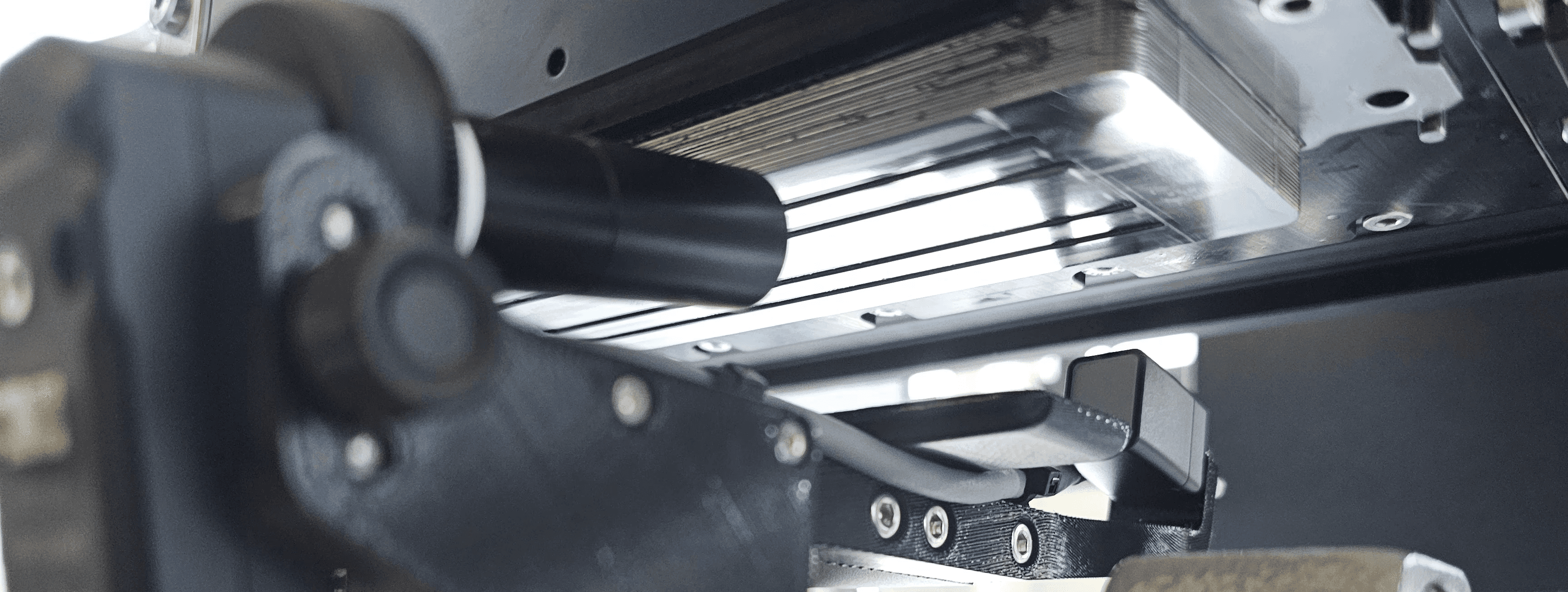 8 exemplary dispensing systems from various manufacturers with mounted droptical Drop Watcher