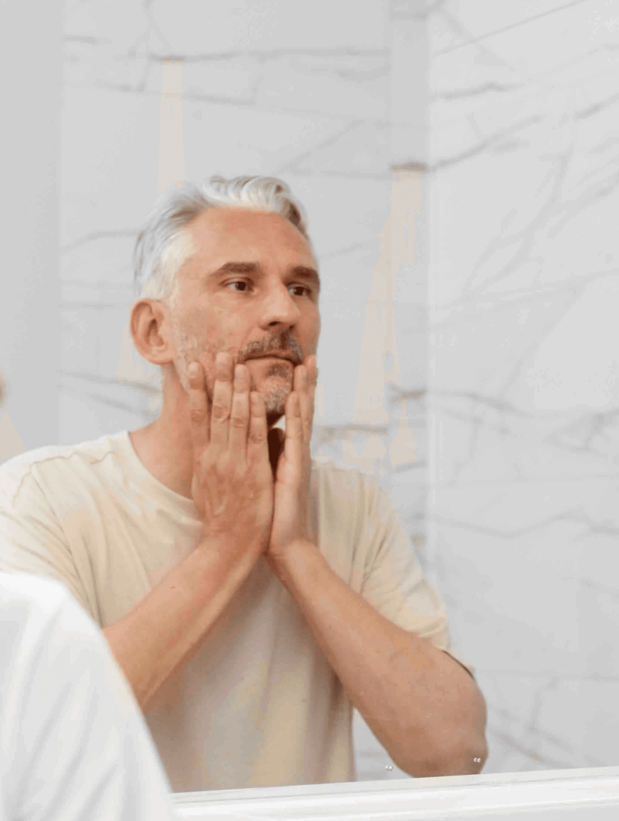 Man looking at himself in mirror