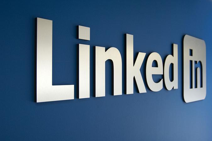 LinkedIn logo displayed on a blue background, featuring bold white lettering and a professional, minimalist design.