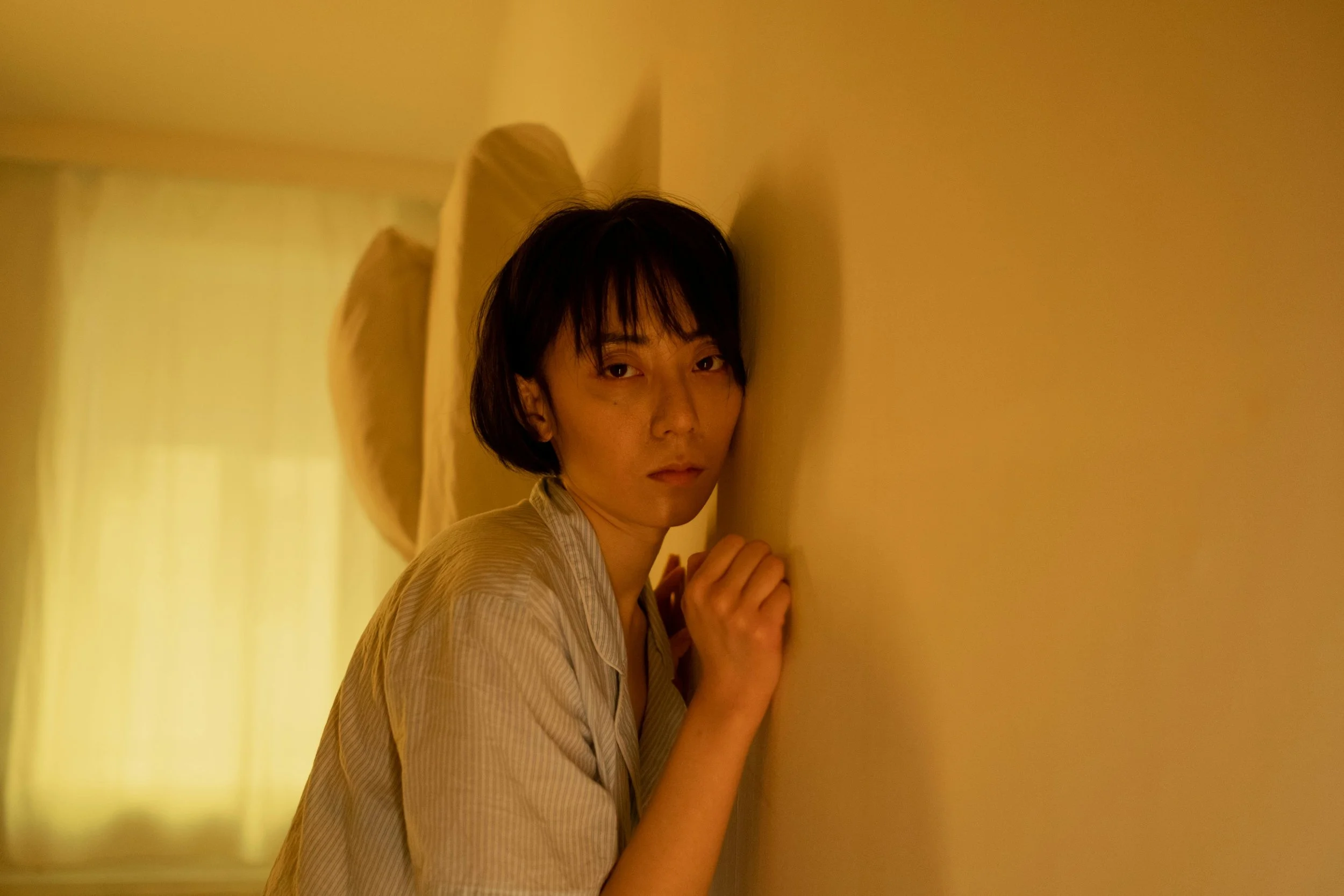 Woman against a wall