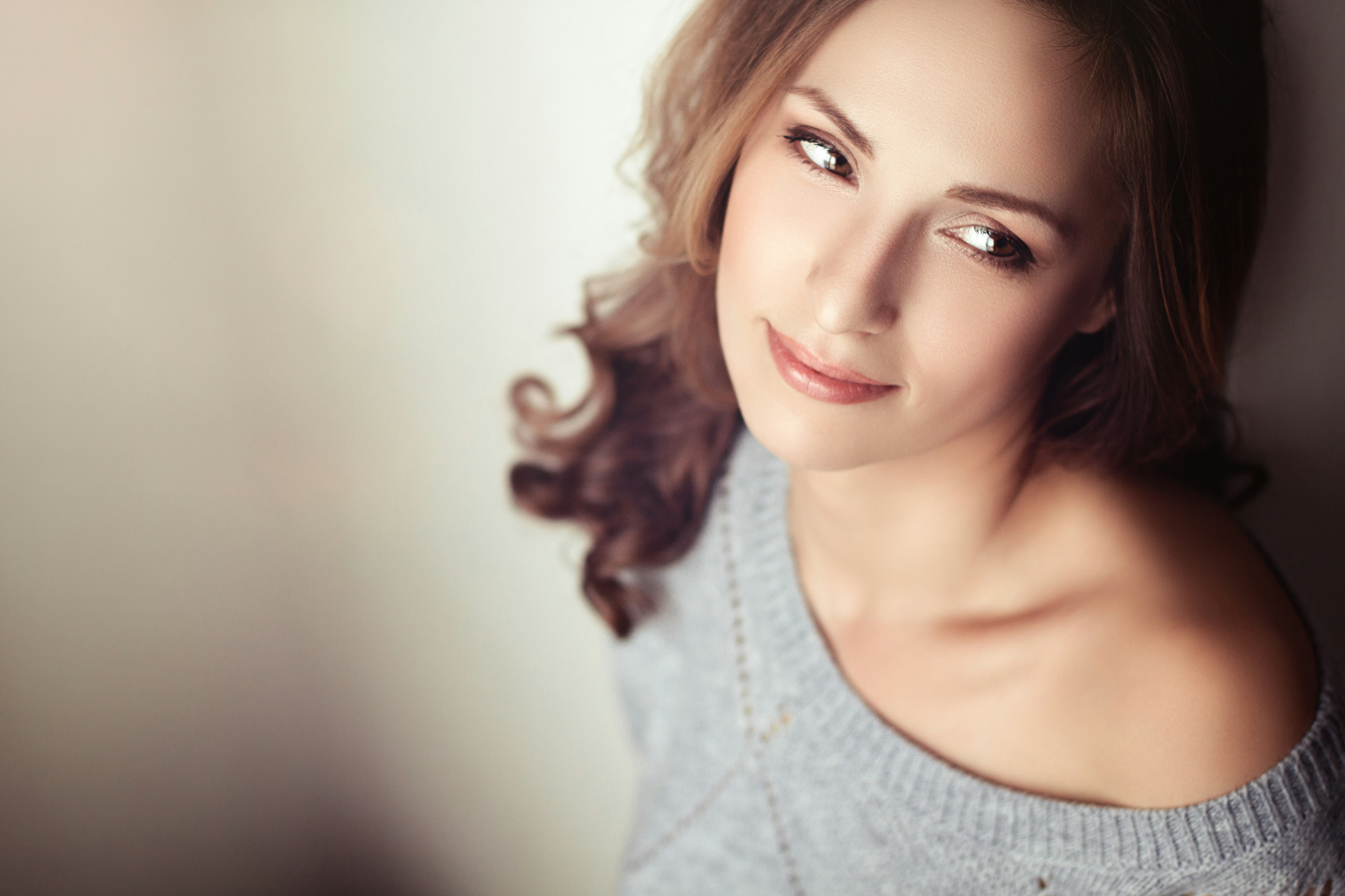 Woman posing for hybrid laser service