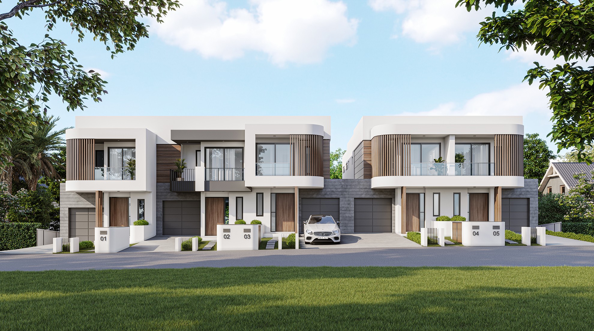 Dual-dwelling modern facade with symmetrical design, light cladding, and generous front setback.