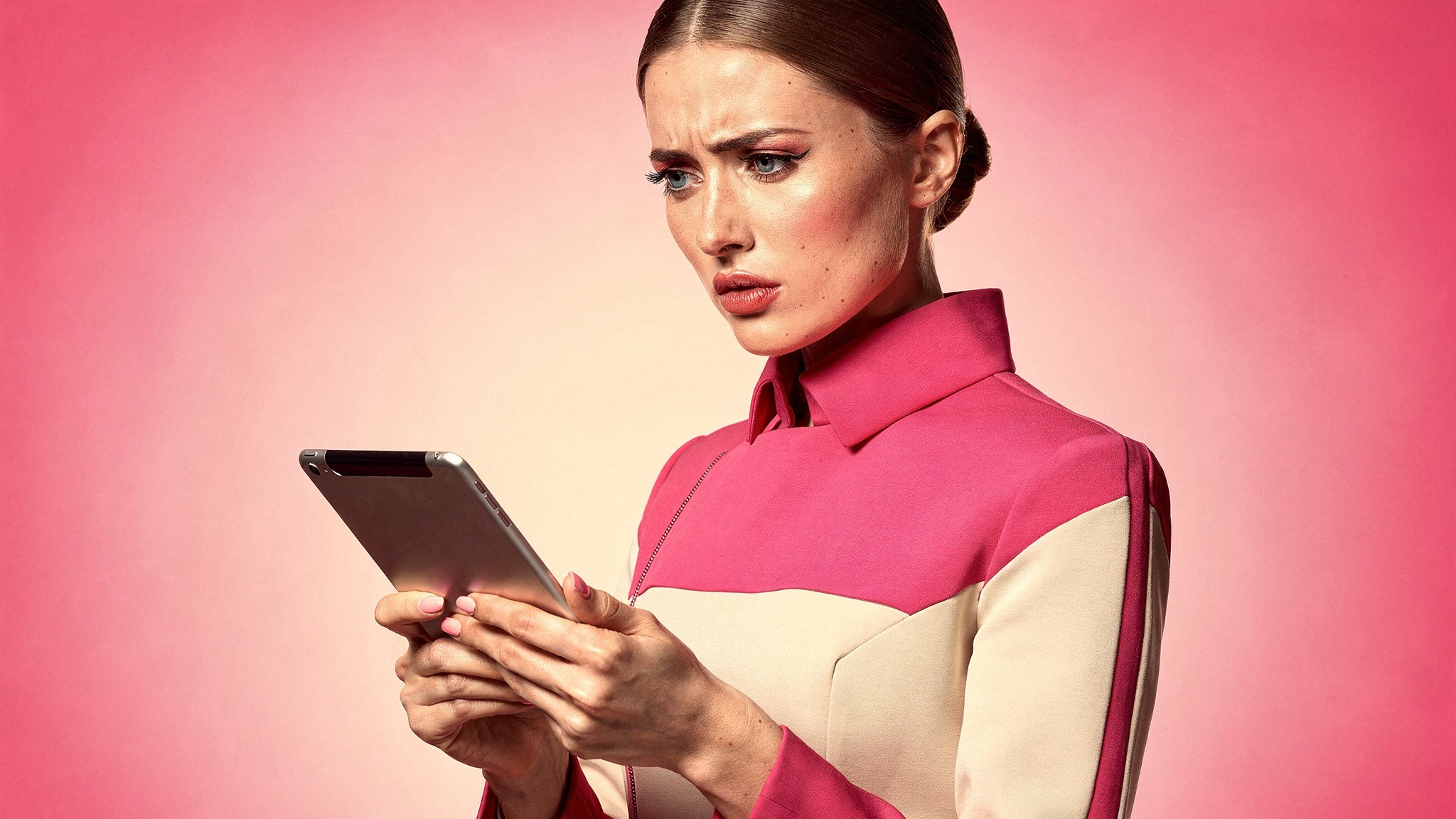Creator looking unconvinced at AI results on a tablet, why generic ai photos fail