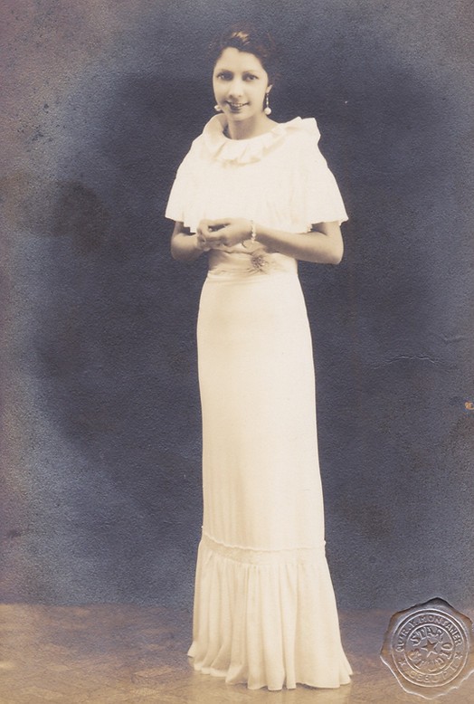 Pepita in a long white gown.jpeg