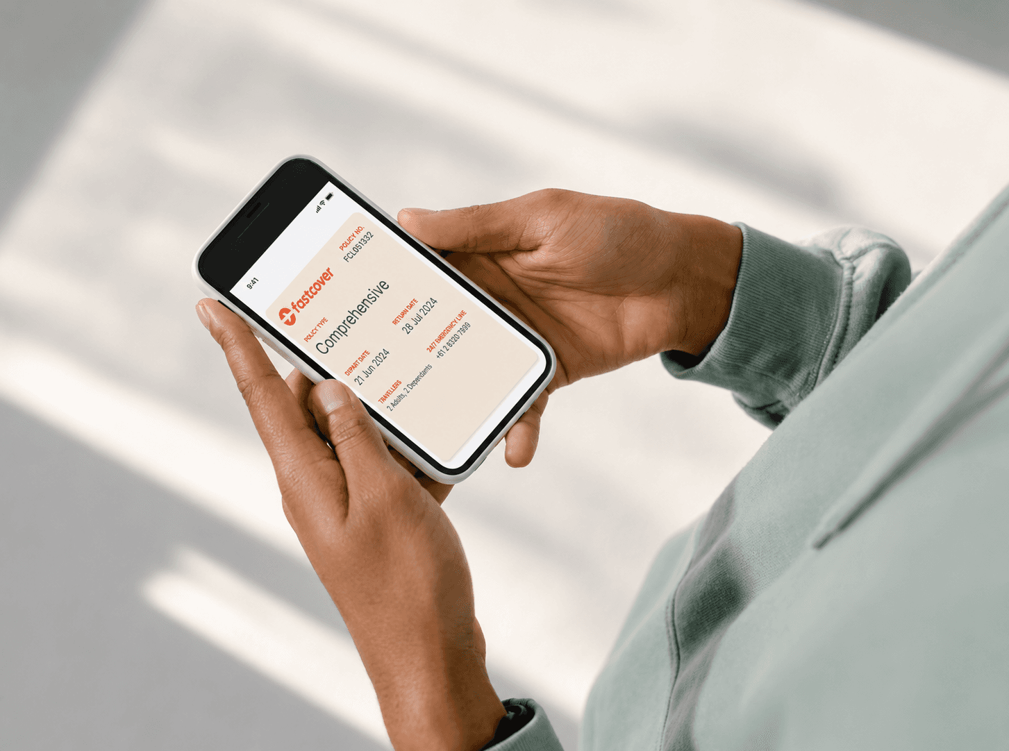 person using fast cover website on mobile phone