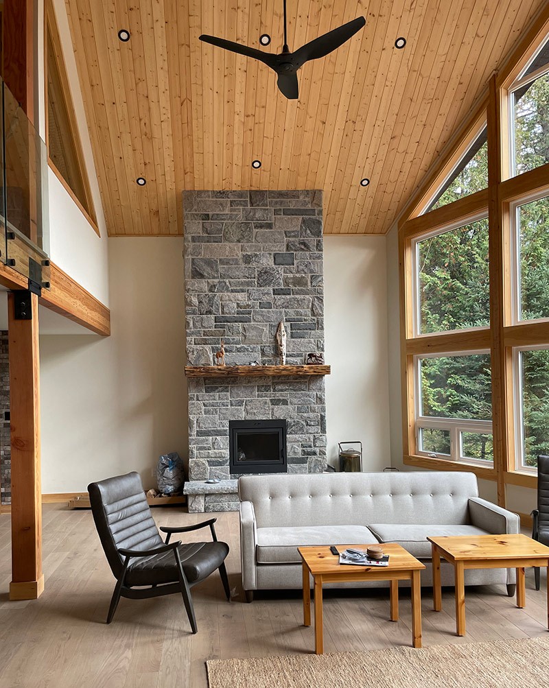 high end haliburton cottage interior with high ceilings and luxury furniture