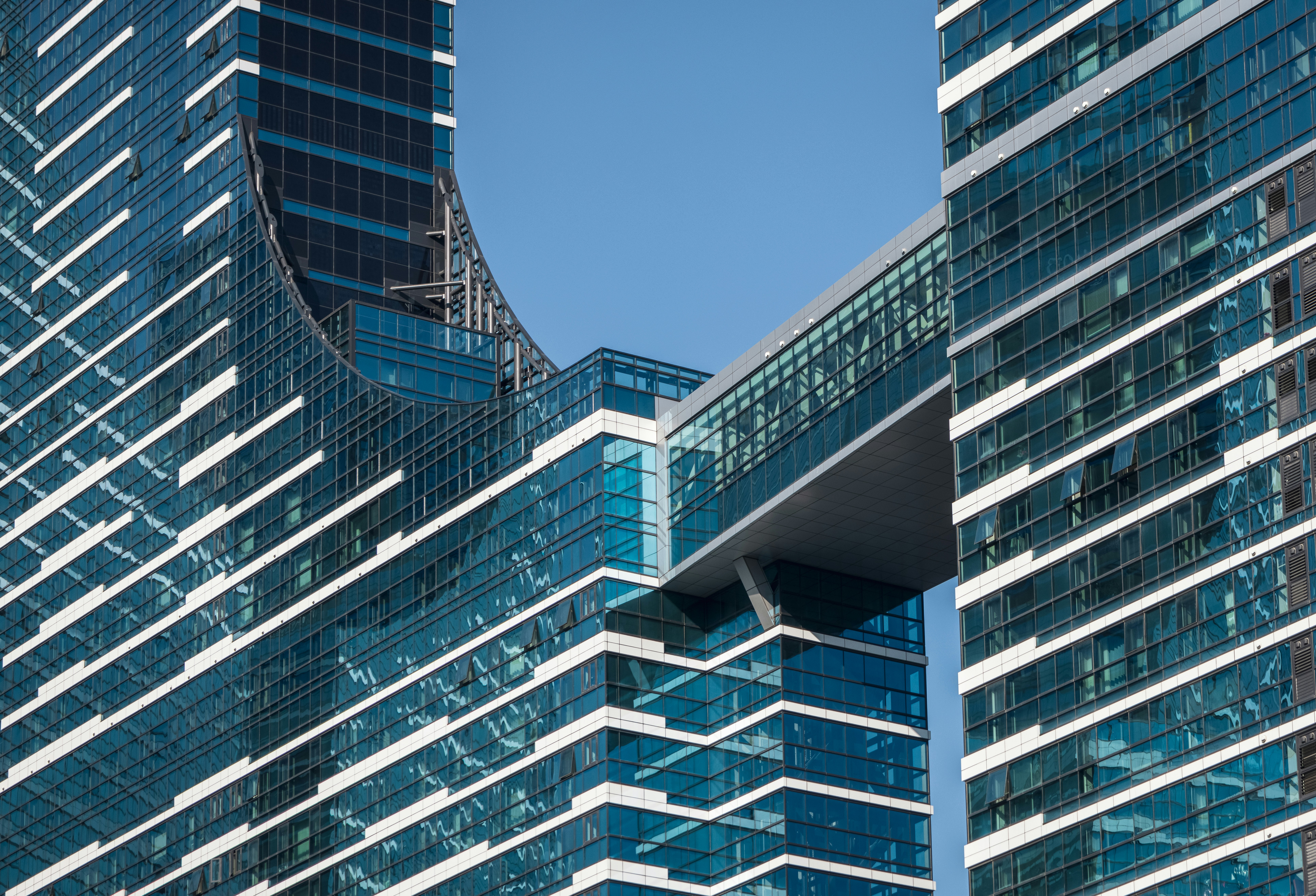 a couple of tall buildings with a sky scraper in the background