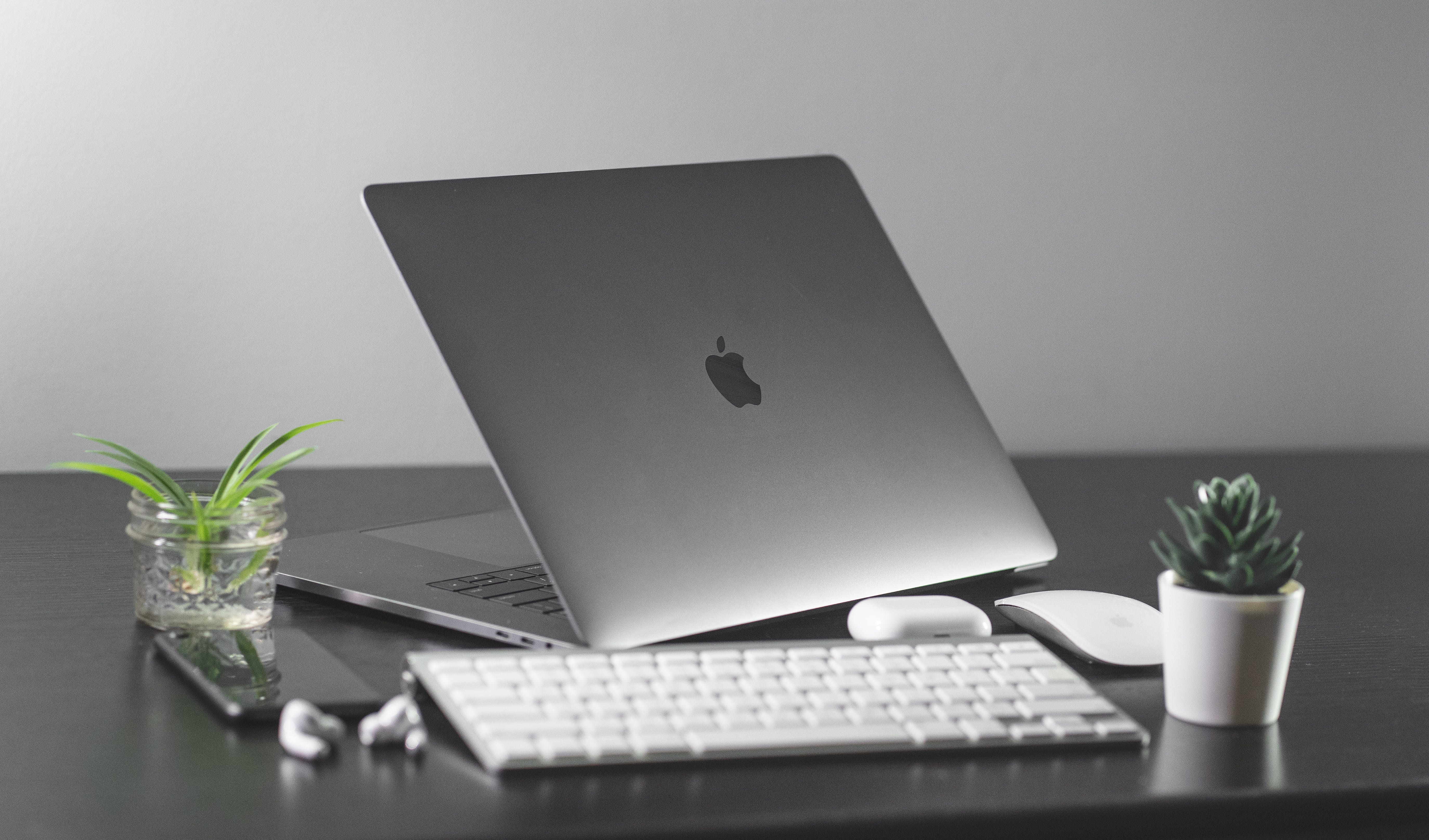 Macbook on a table being used to send cold emails to maximize outreach impact