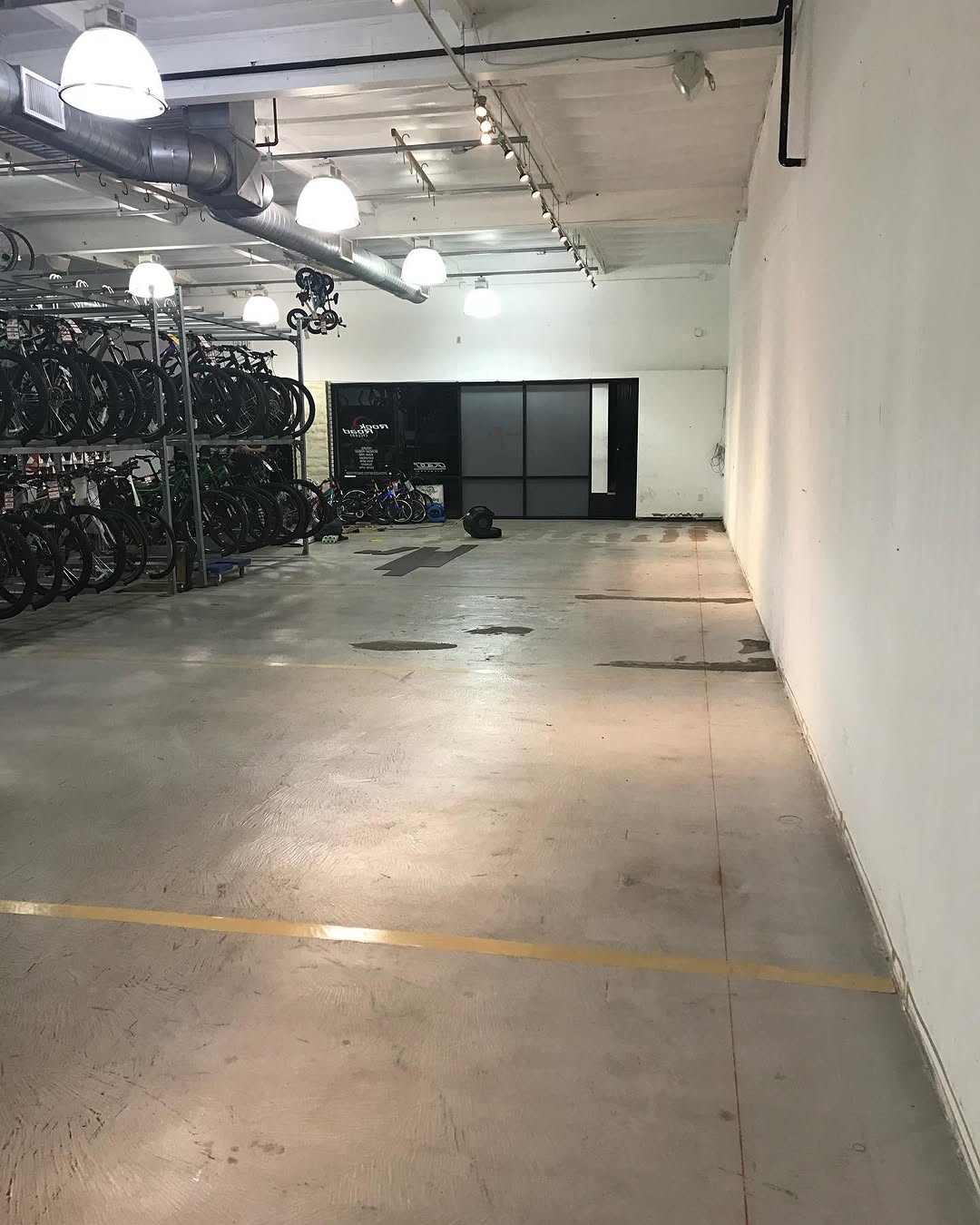 Bare retail floor in a bike shop before new flooring goes down