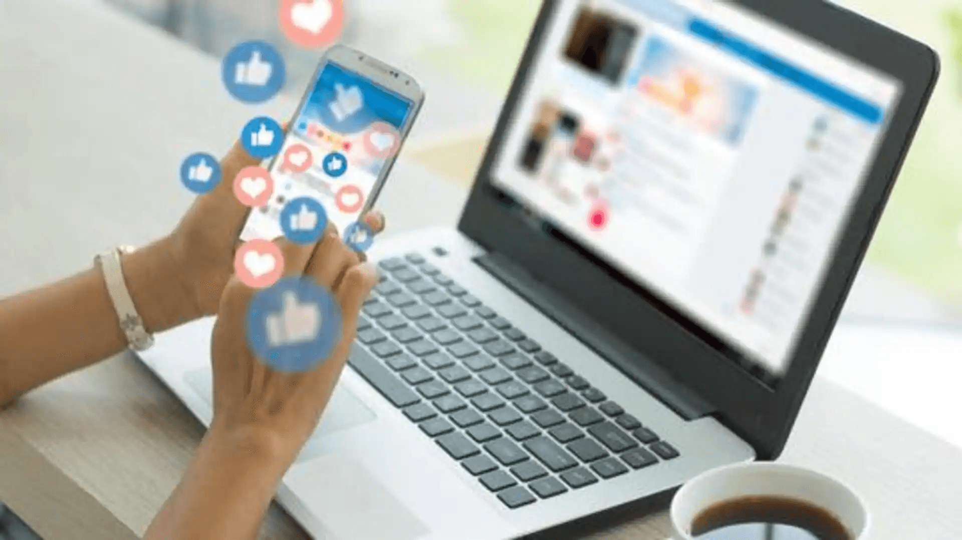 Smartphone and laptop displaying social interactions -  AI Tools for Social Media Content Creation