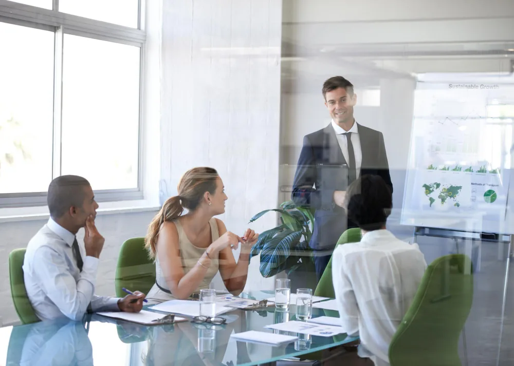 Enterprise governance workshop with professionals reviewing operational strategy, oversight frameworks, and AI governance methodology.