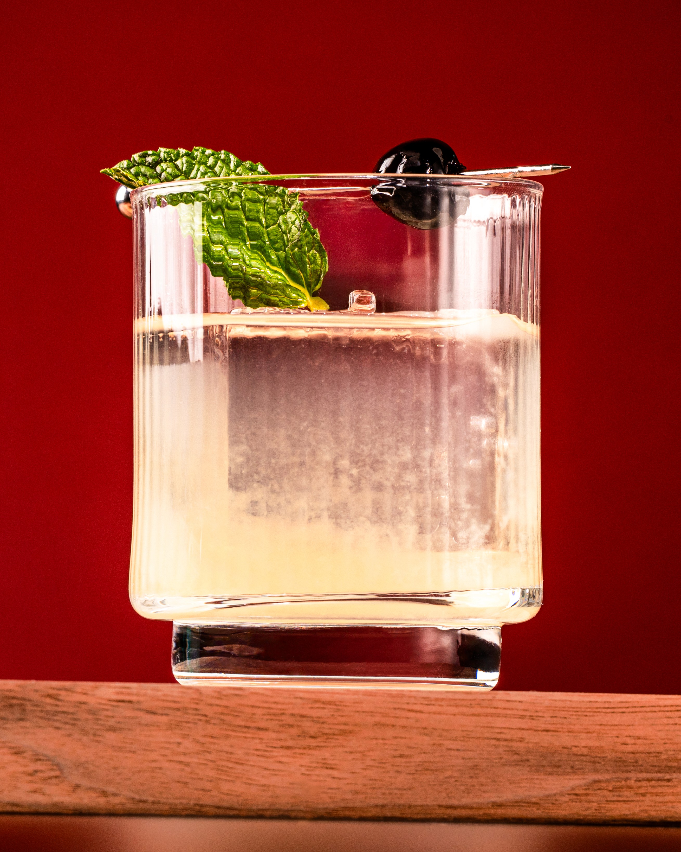 Artistic portrait with red and blue lighting creating a dramatic effect