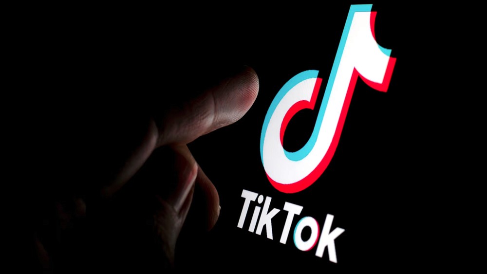 Red digital warning symbol glowing on a circuit board interface, representing active ransomware exploitation of the VMware ESXi CVE 2025 22225 vulnerability and hypervisor compromise.