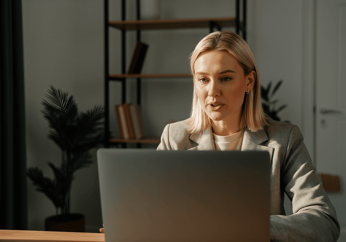 Business woman operating a laptop