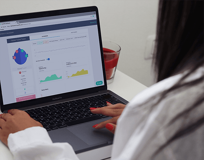  Tracking Progress with Myndlift: A clinician reviews a client's brain                                                                                                                                  activity and performance trends using the Myndlift Clinical Dashboard,                                                                                                                                   enabling informed and precise neurofeedback interventions.