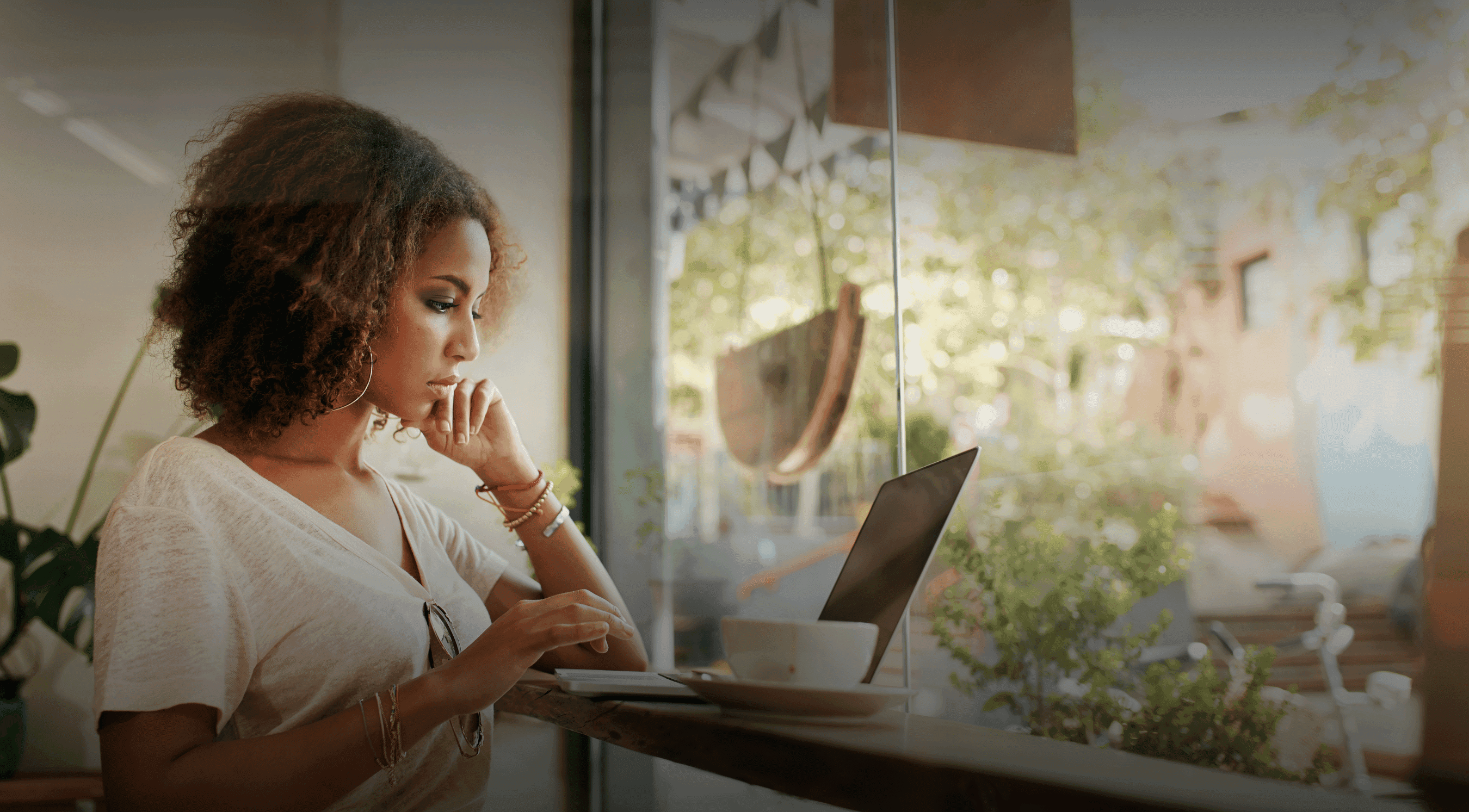 Young black woman working at a laptop