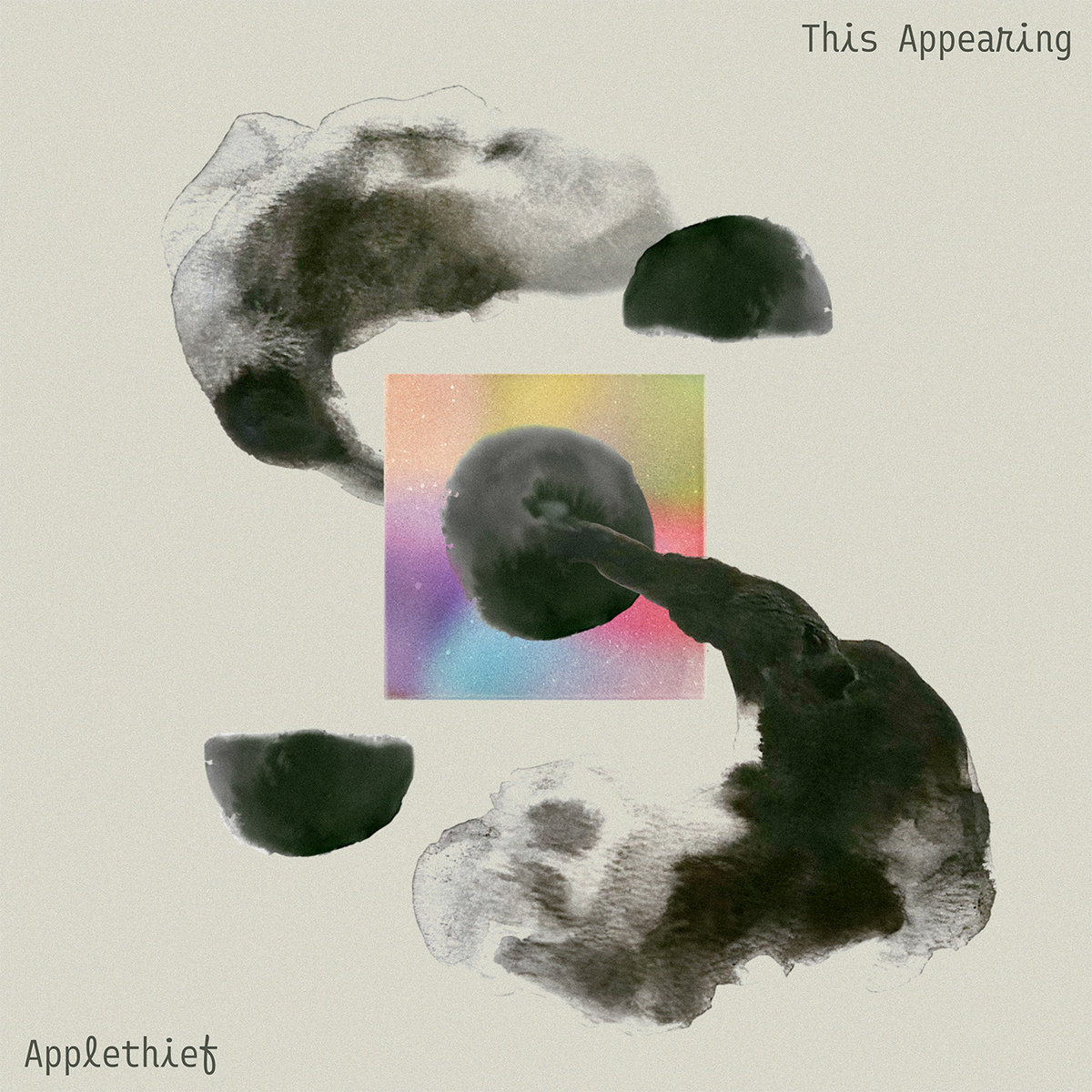 album cover design featuring abstract black ink-like shapes swirling around a central colorful square, with the text 'This Appearing' at the top and 'Appletheif' at the bottom.