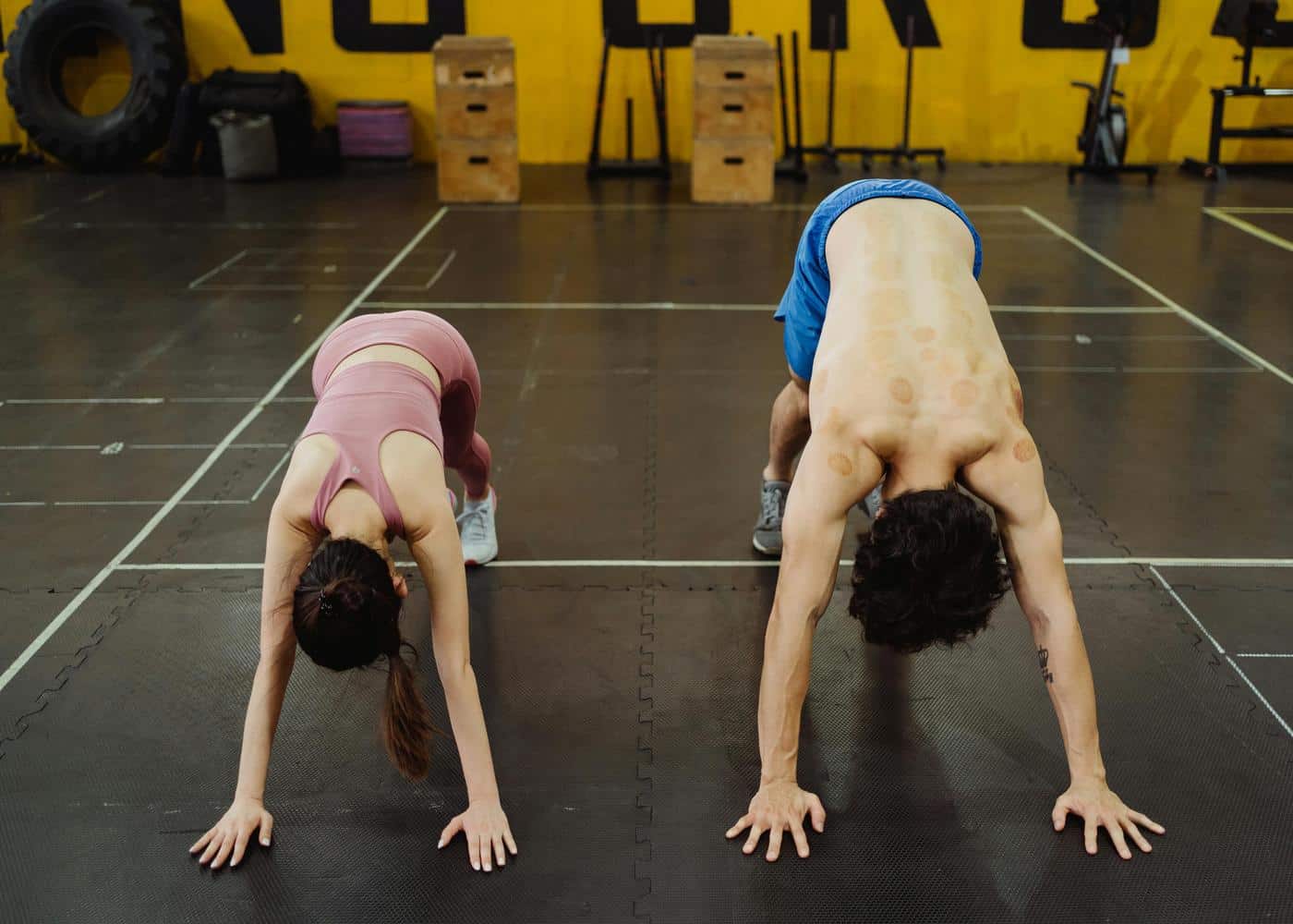 Quadrobics Benefits - Two people stretching on all fours