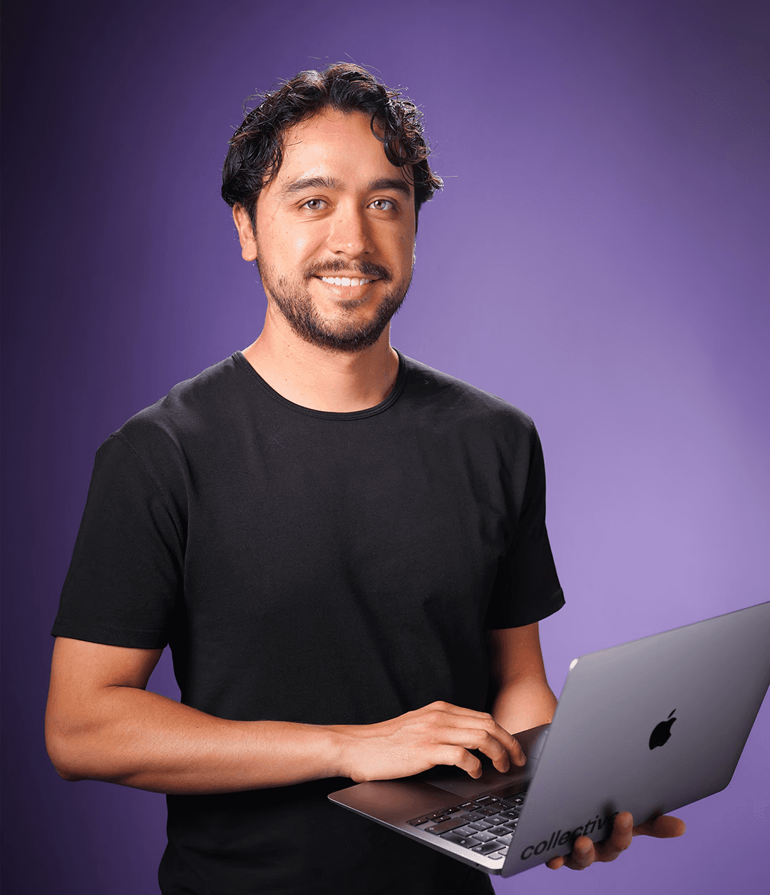A group of focused colleagues gathered around a laptop, deeply engaged in a discussion or presentation