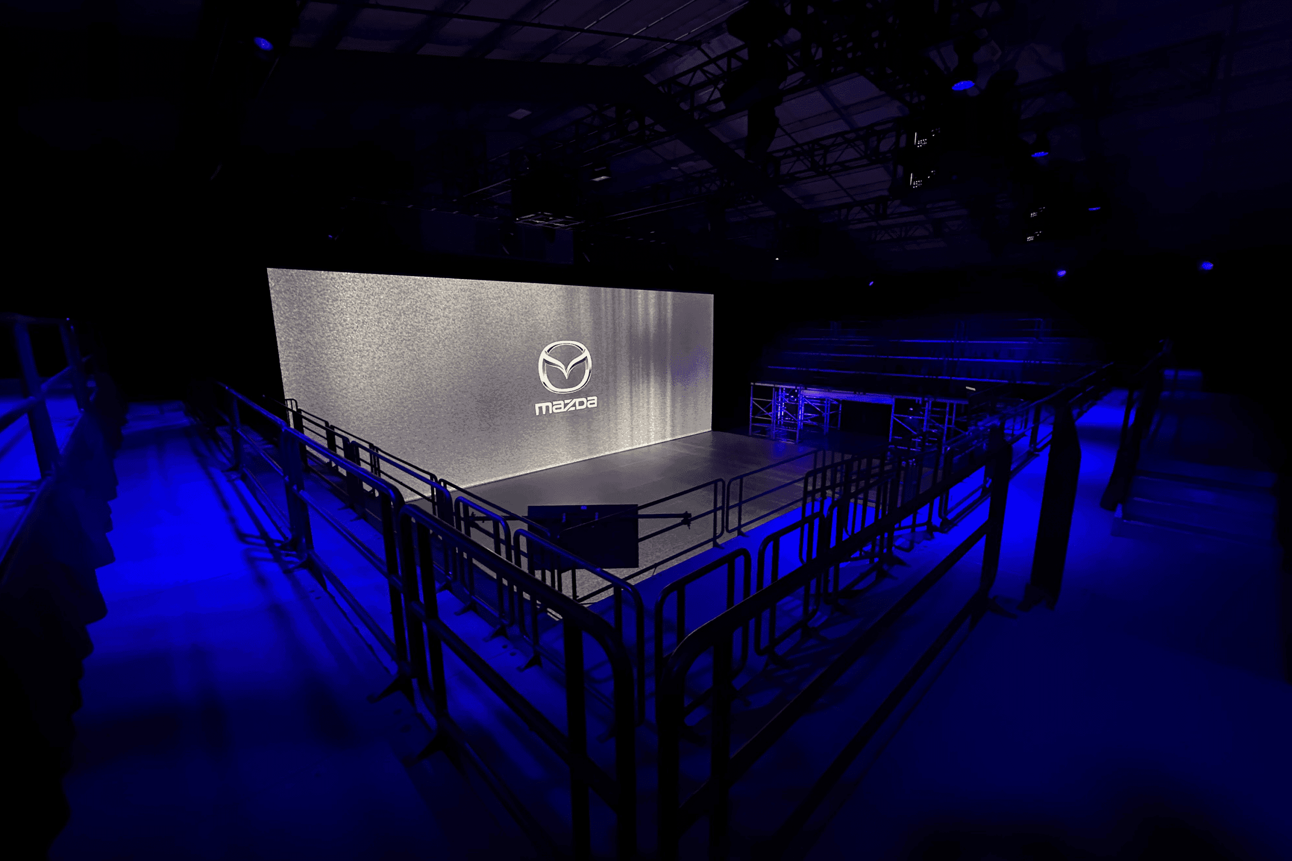 Mazda North America logo with blue lighting and staging