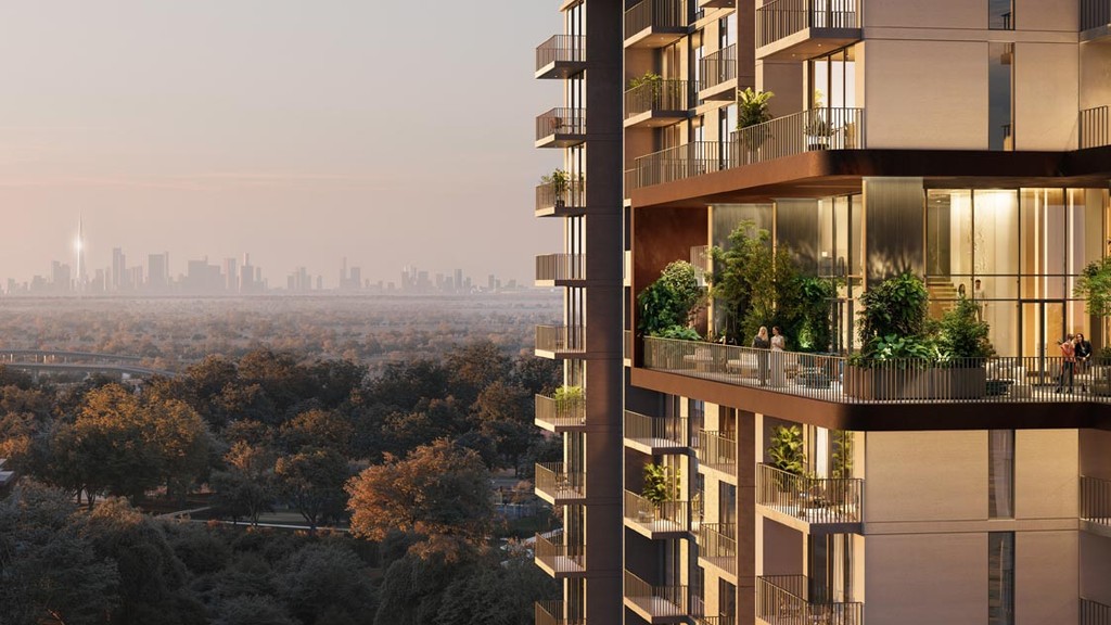 View from the top of a building overlooking Distrikt Ghaf Woods, showcasing lush greenery and expansive landscapes.