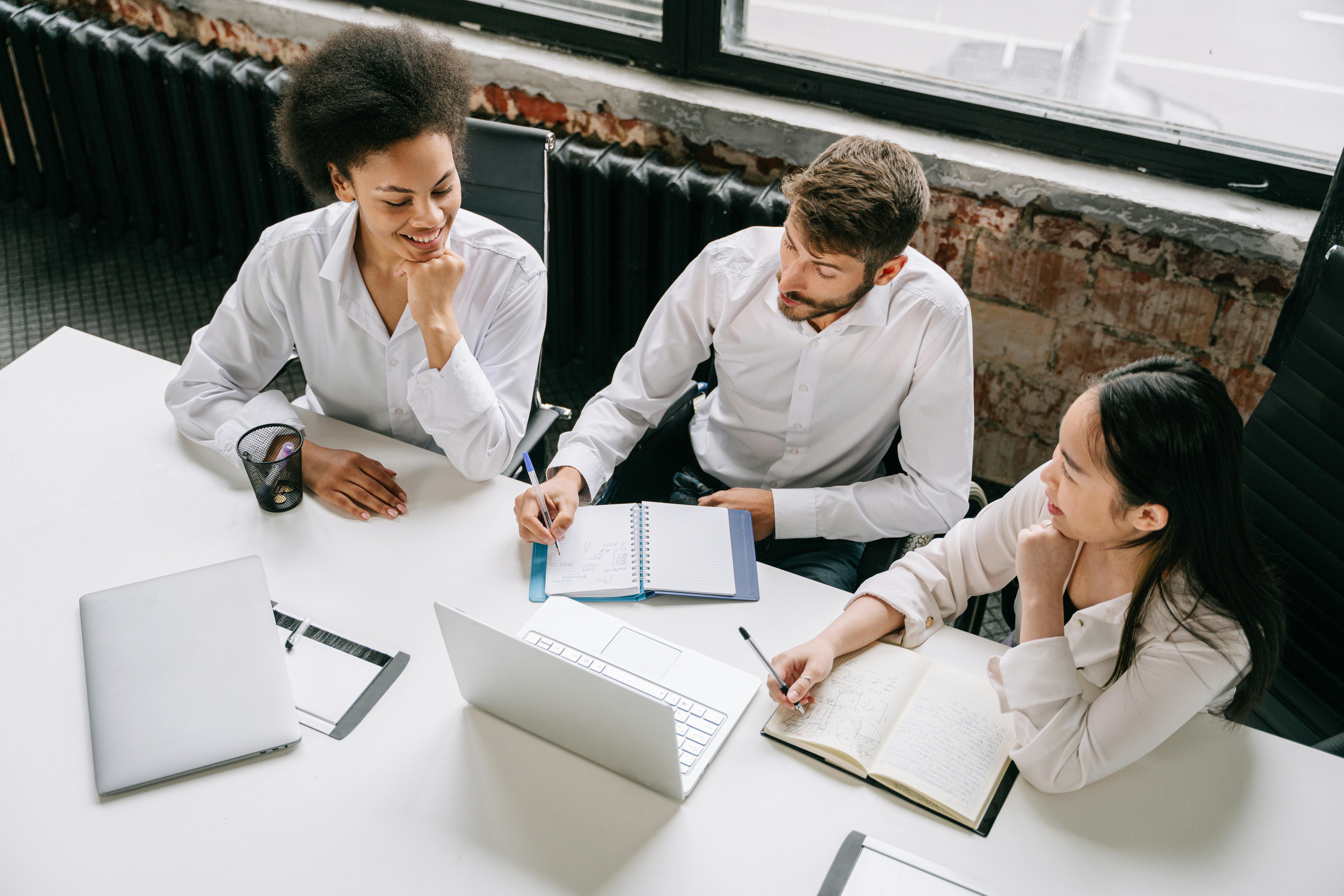Birdseye view of three office workers working together