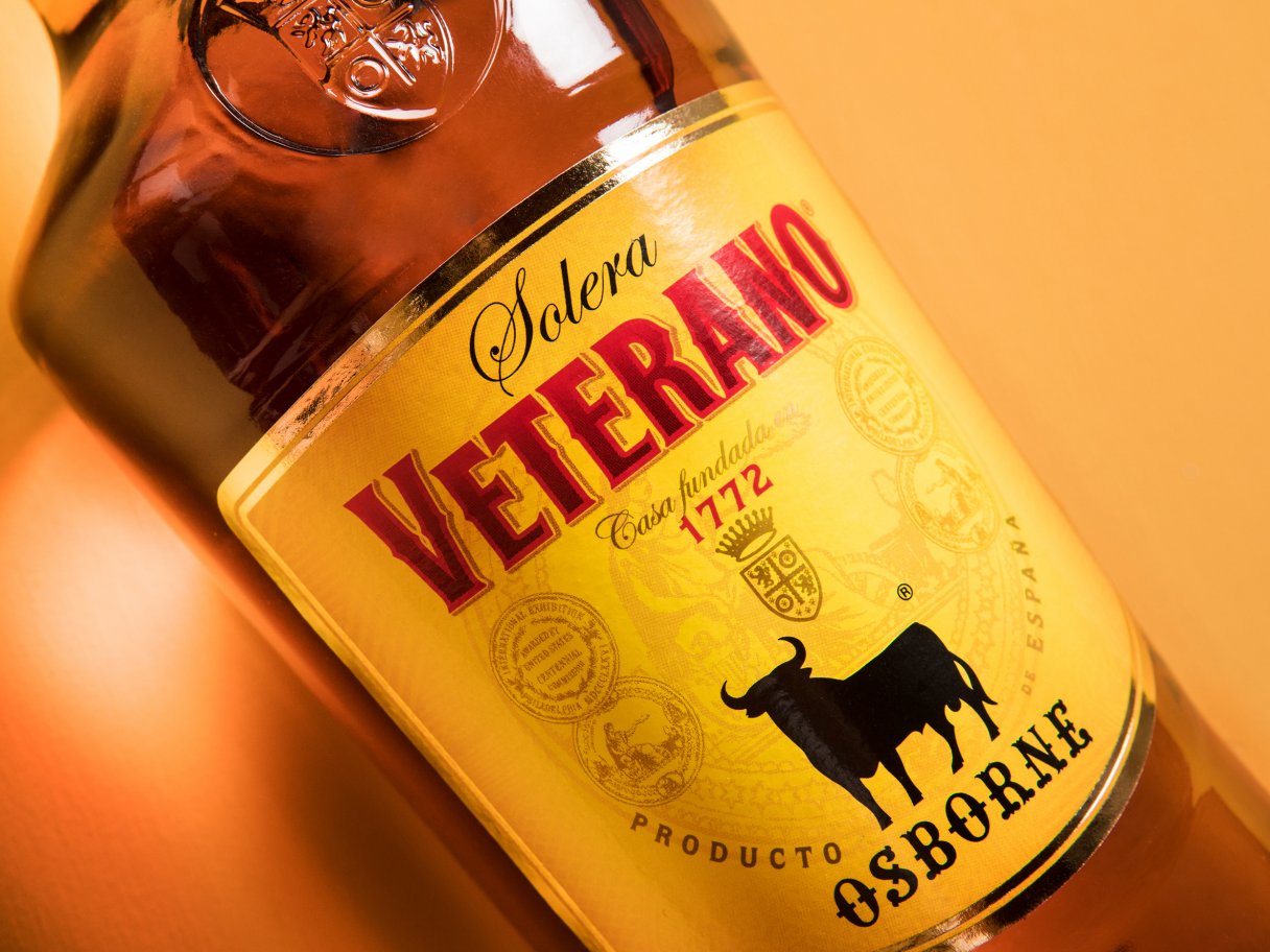 Rustic cabin in a golden field at sunset