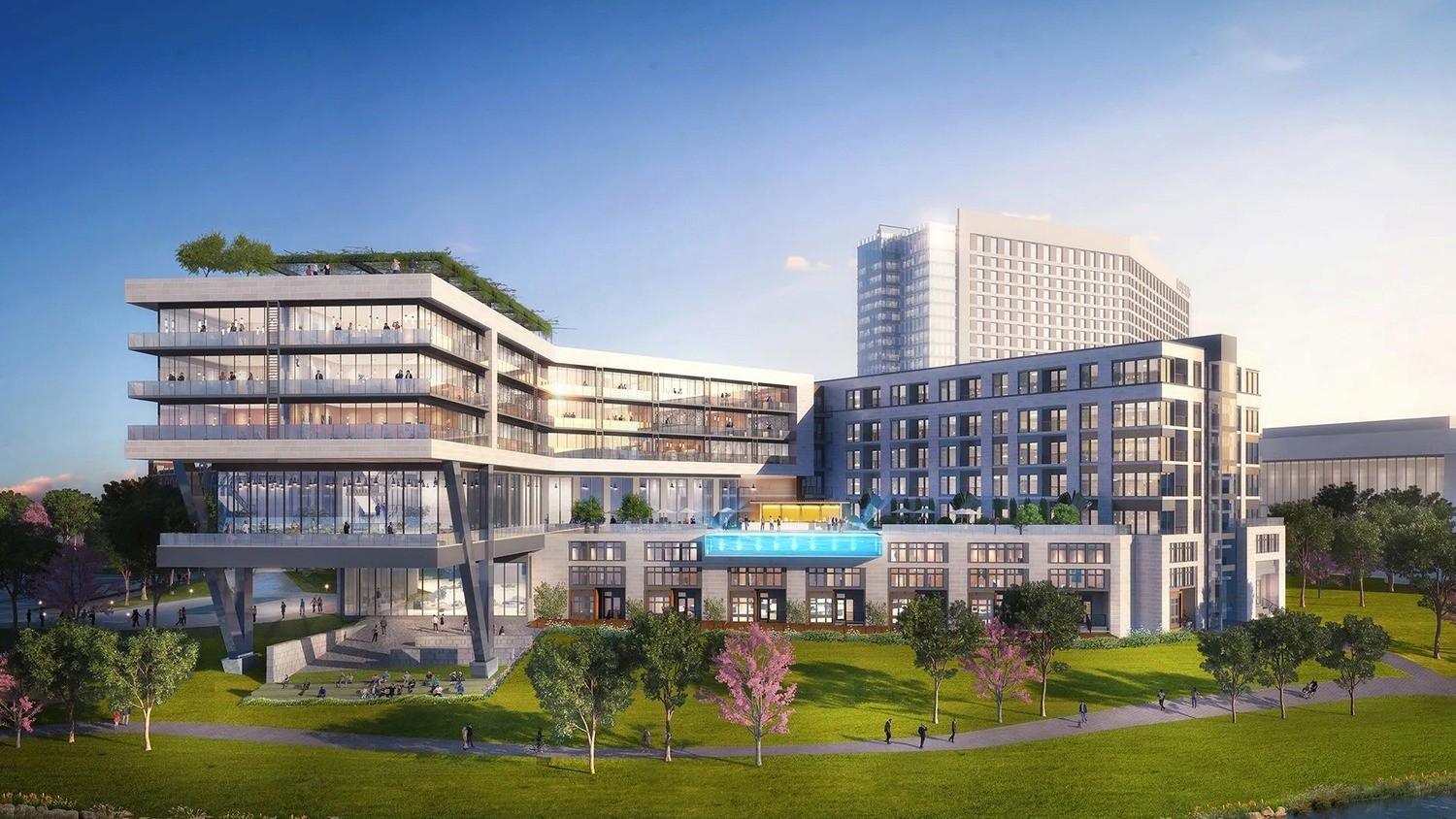 Architectural rendering of a large, modern multi-story mixed-use building complex featuring an elevated outdoor pool and extensive glass facades, showcasing a major construction project protected by M-Fire