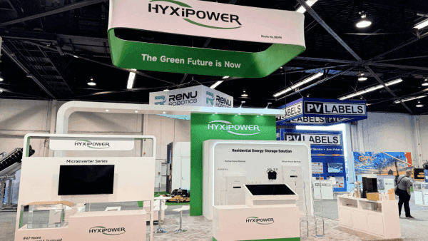 Angled view of a 20x30 RE+ Southeast booth with product hierarchy, explanation counter, and semi-separated meeting space