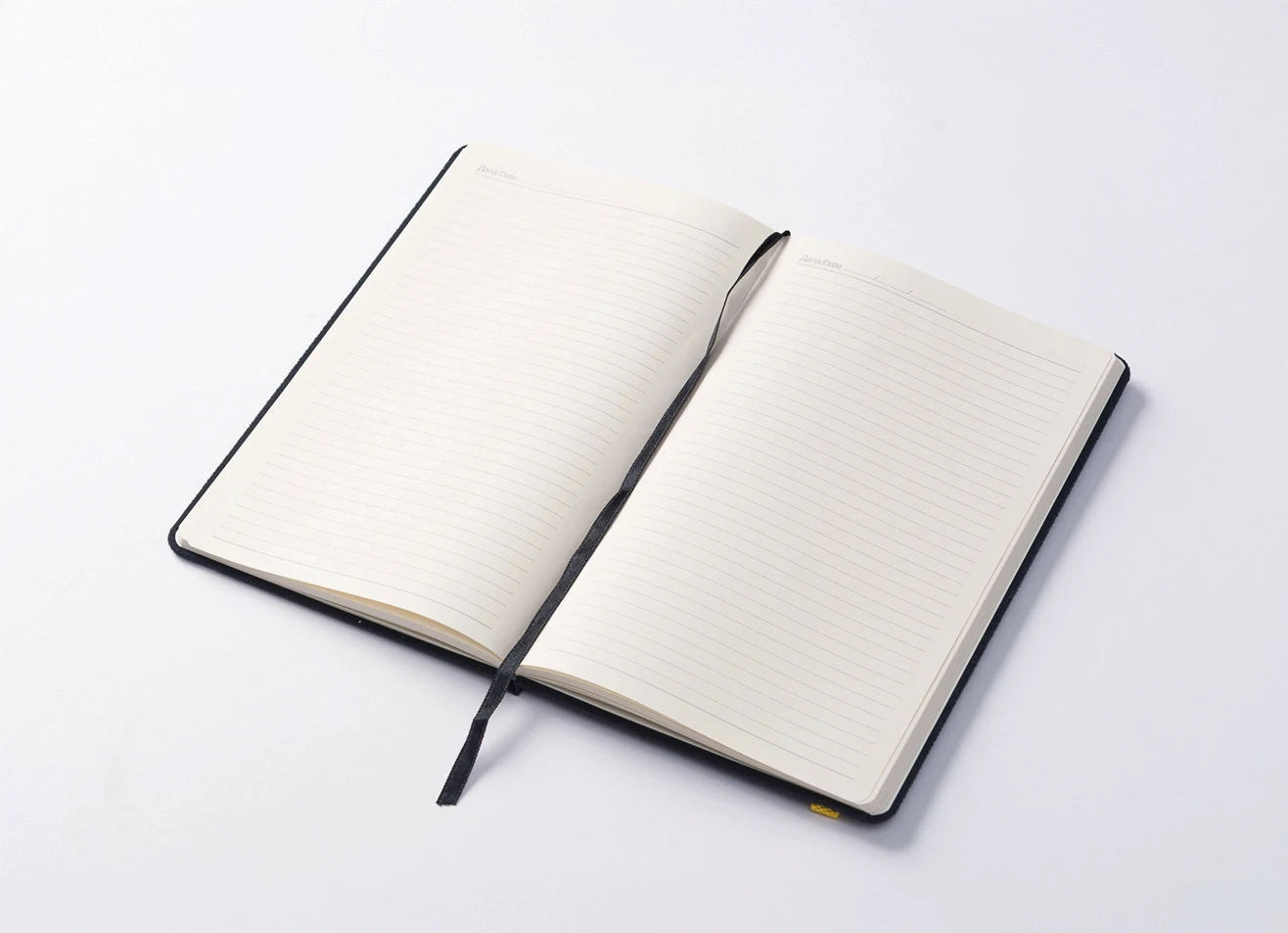 Open notebook displaying lined pages with top date field.
