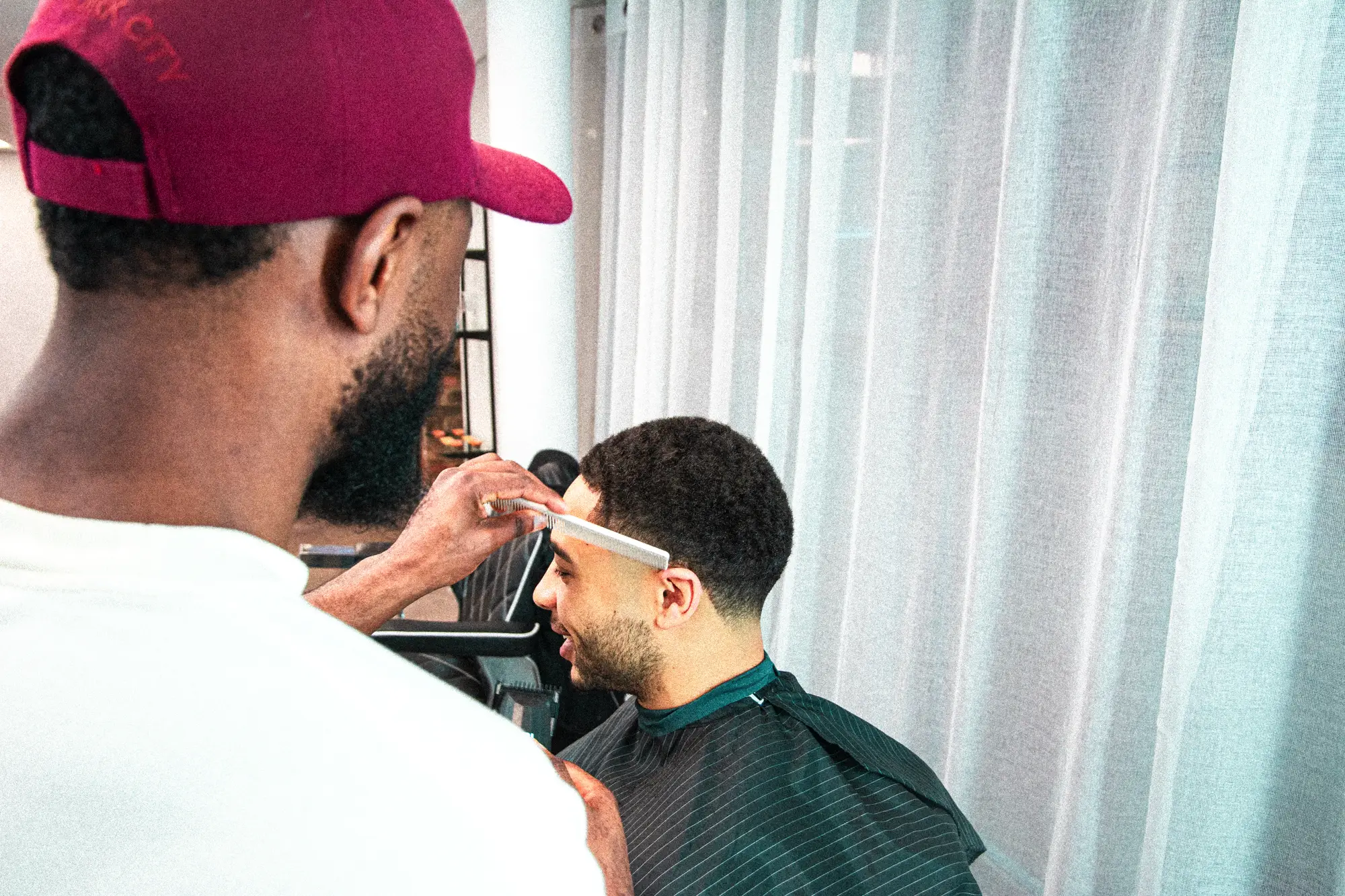 Barber Using Comb on Client.