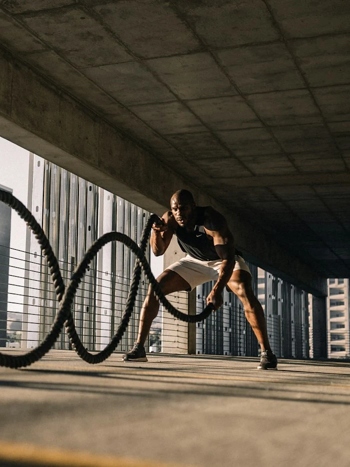 A member working battle ropes