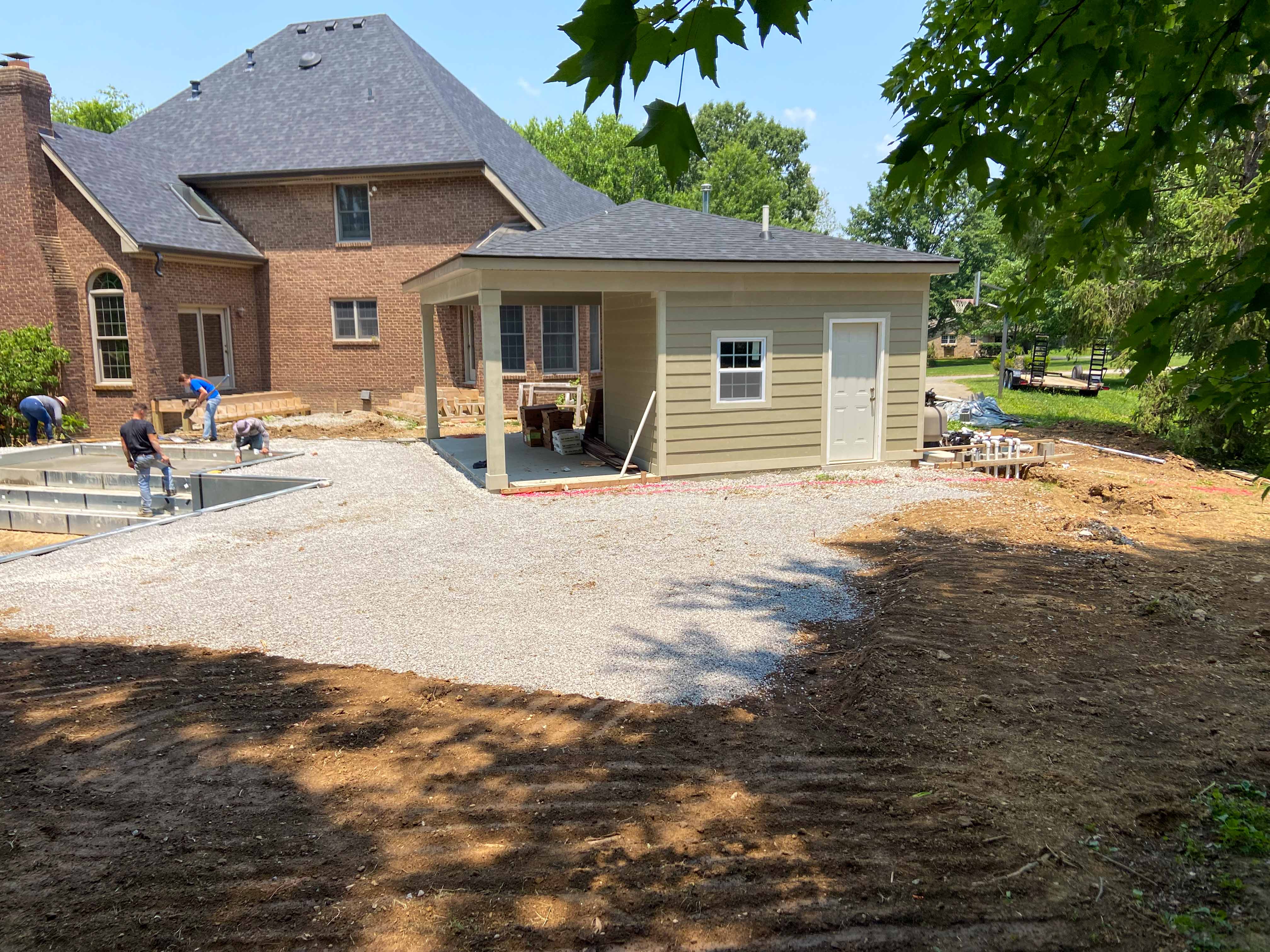 standalone pool house while fiberglass pool is being installed