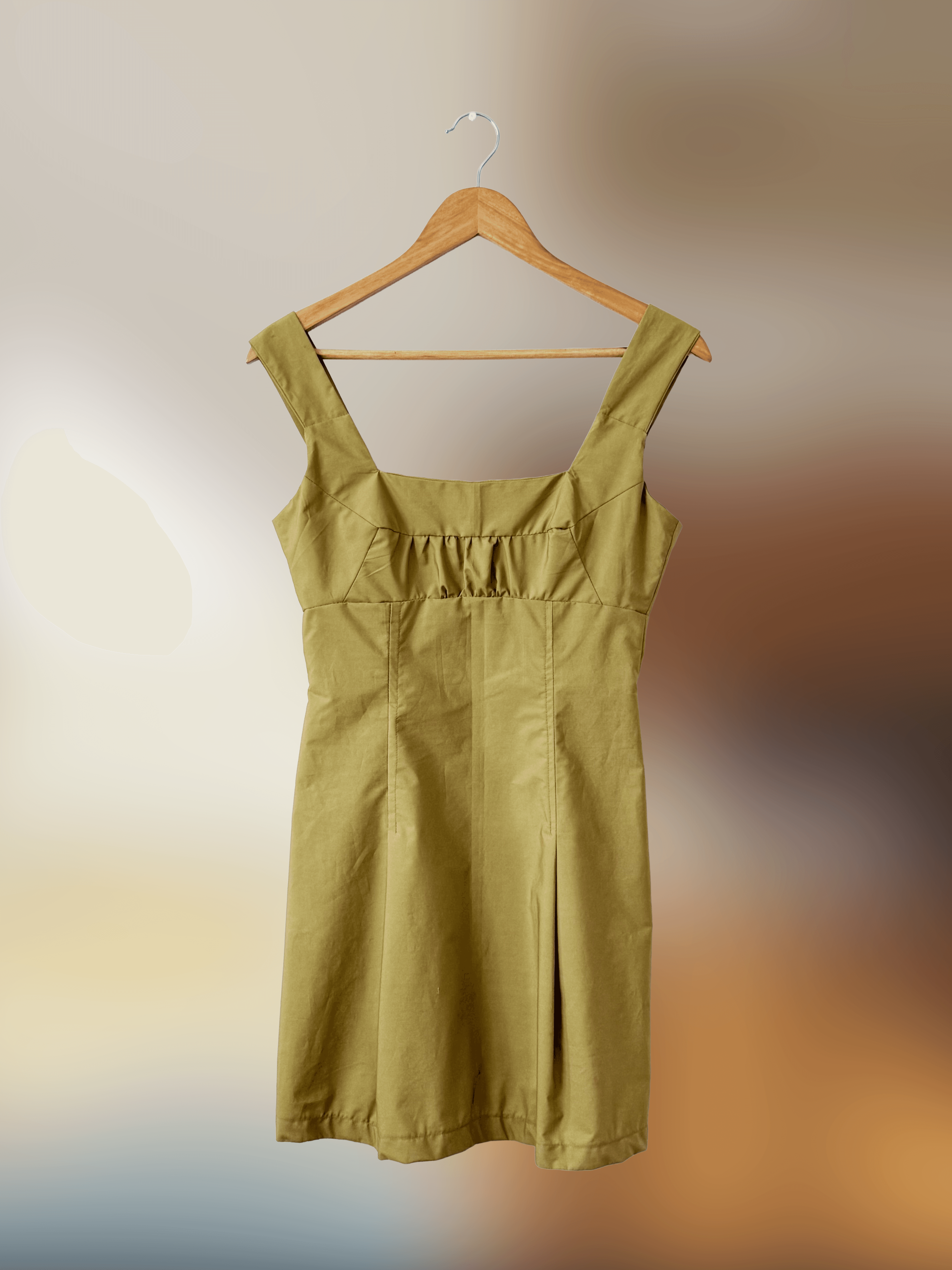 muted green mini dress with thick straps and a straight neckline 