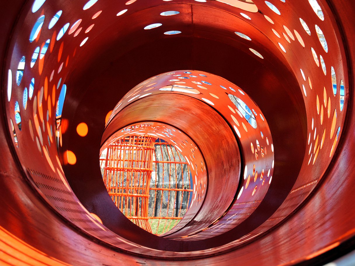 Rooftops of a coastal town with the sea in background