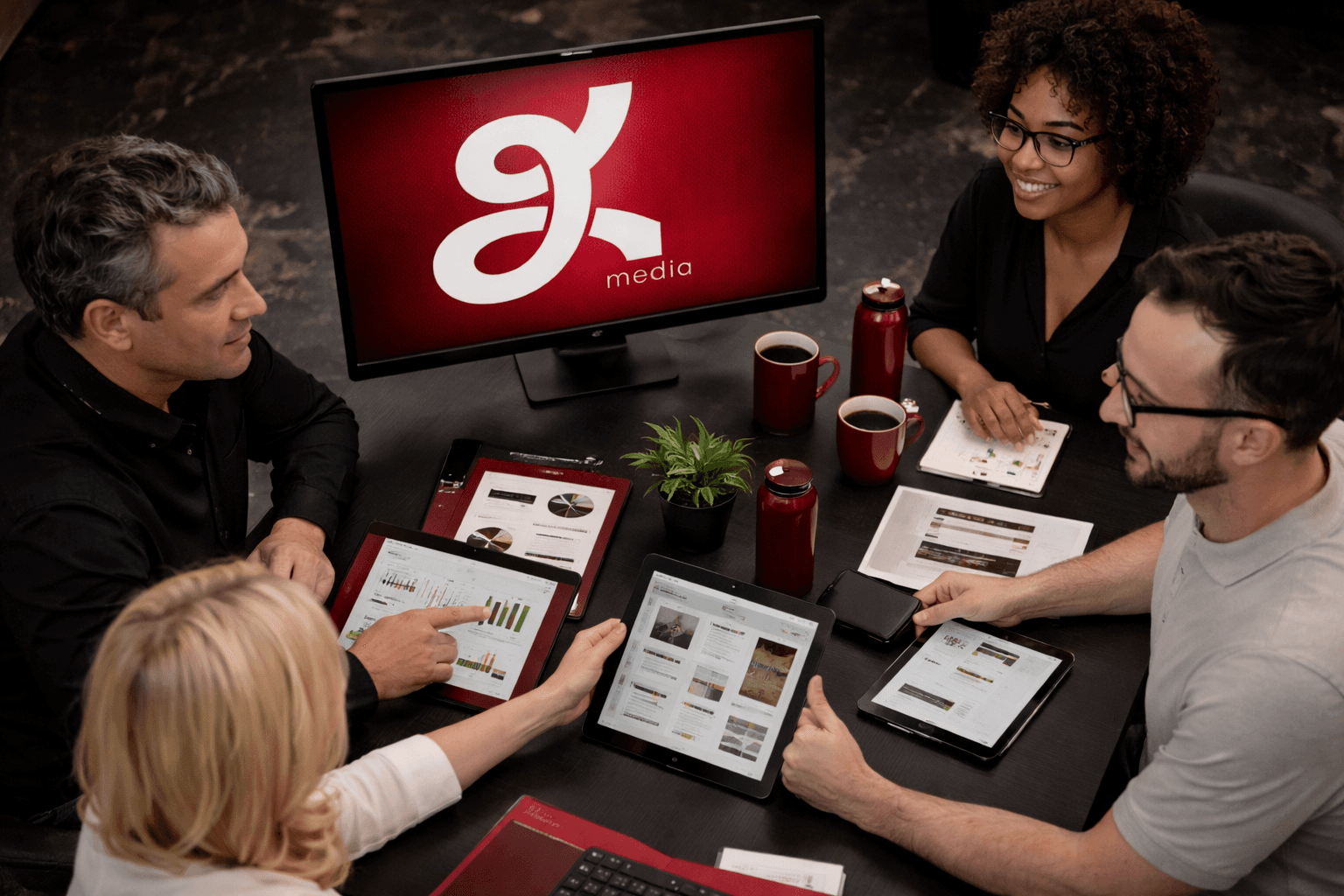 Corporate and professional services branding strategy with team reviewing brand identity and digital marketing materials in a branding agency meeting in Dubai.