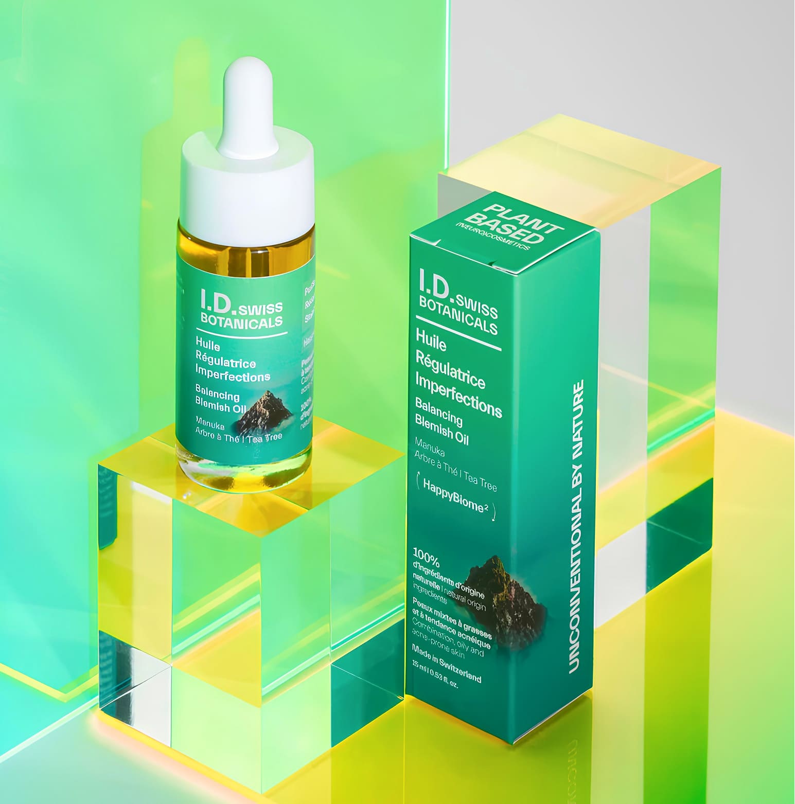 I.D. Swiss Botanicals blemish oil product and packaging showcased in colorful composition reflecting premium skincare branding