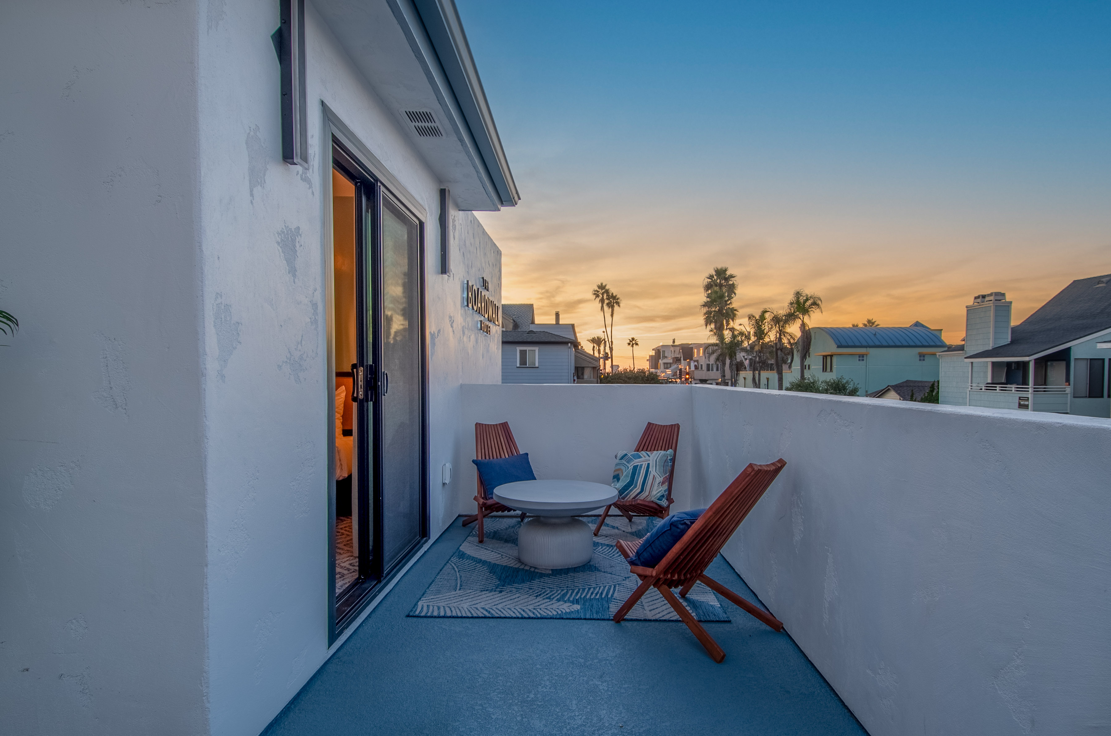 photo of brown bench near swimming pool