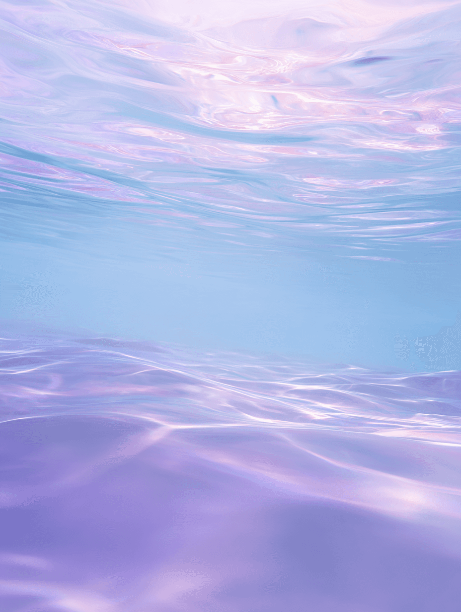 A blurry image of a flower on a blue and pink background