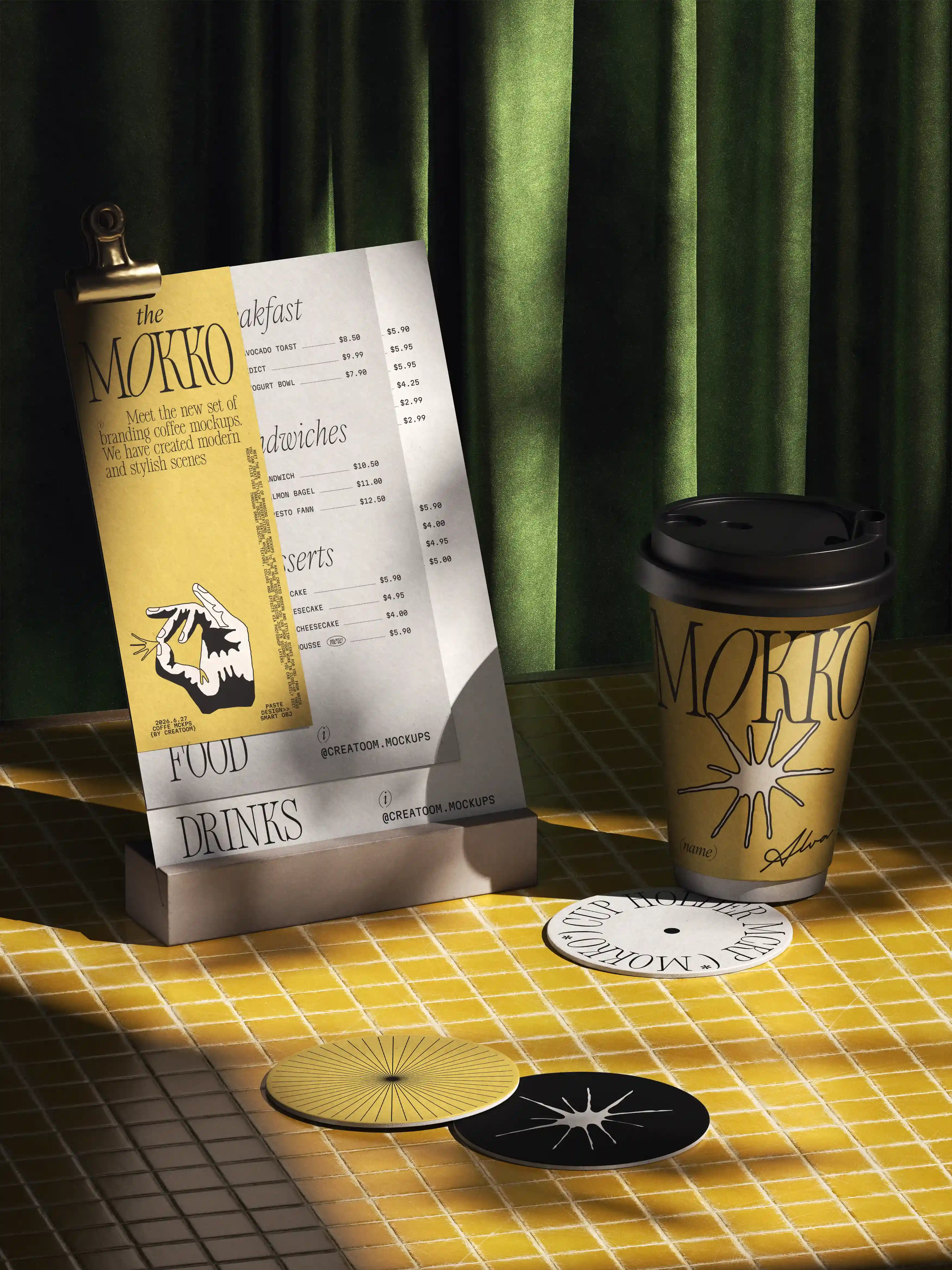 Printed menu and branded coffee cup on yellow tiled table with green curtain backdrop