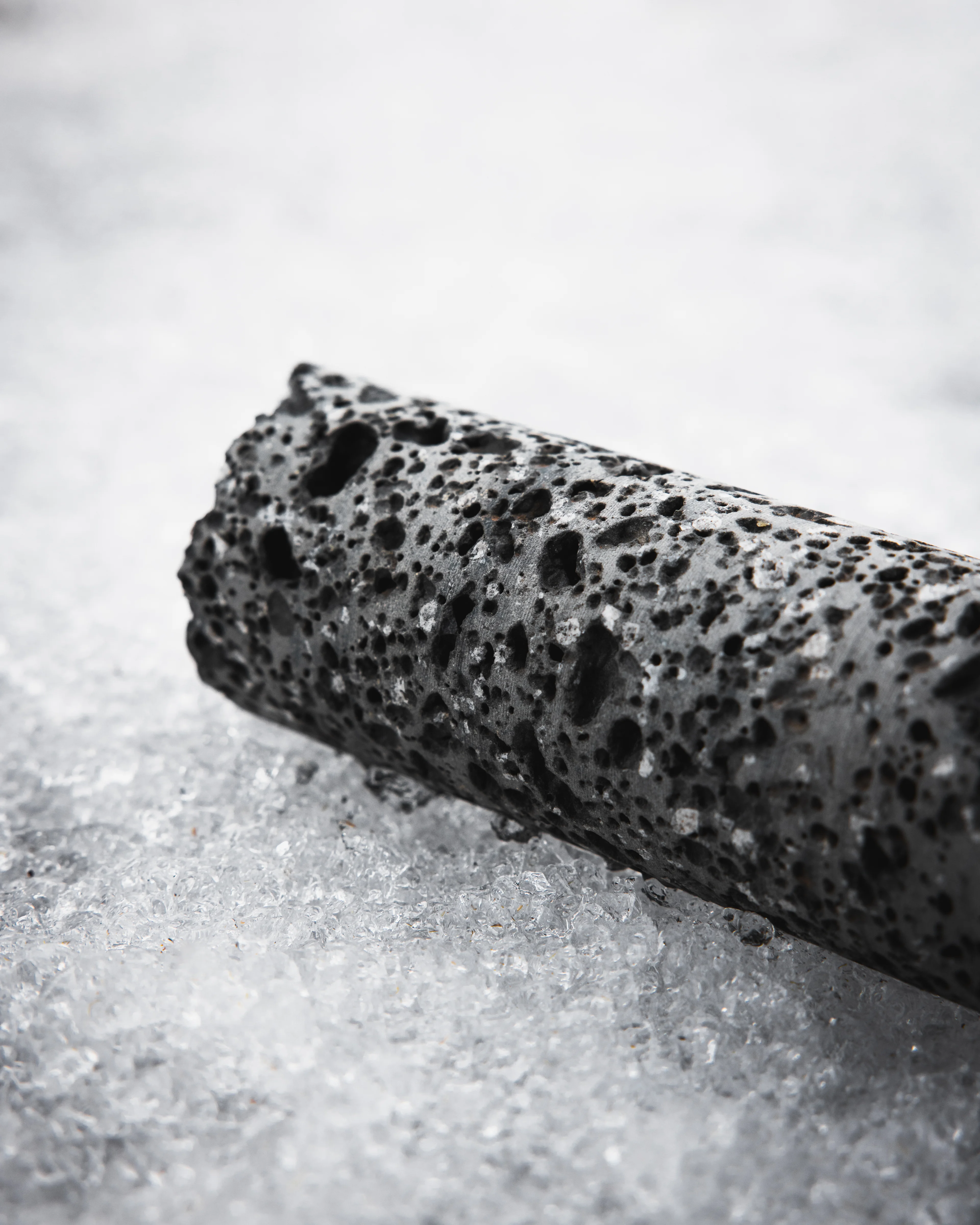Close-up of carbon dioxide stored in basalt rock, where it has been sequestered underground and naturally mineralized for safe, permanent CO₂ storage