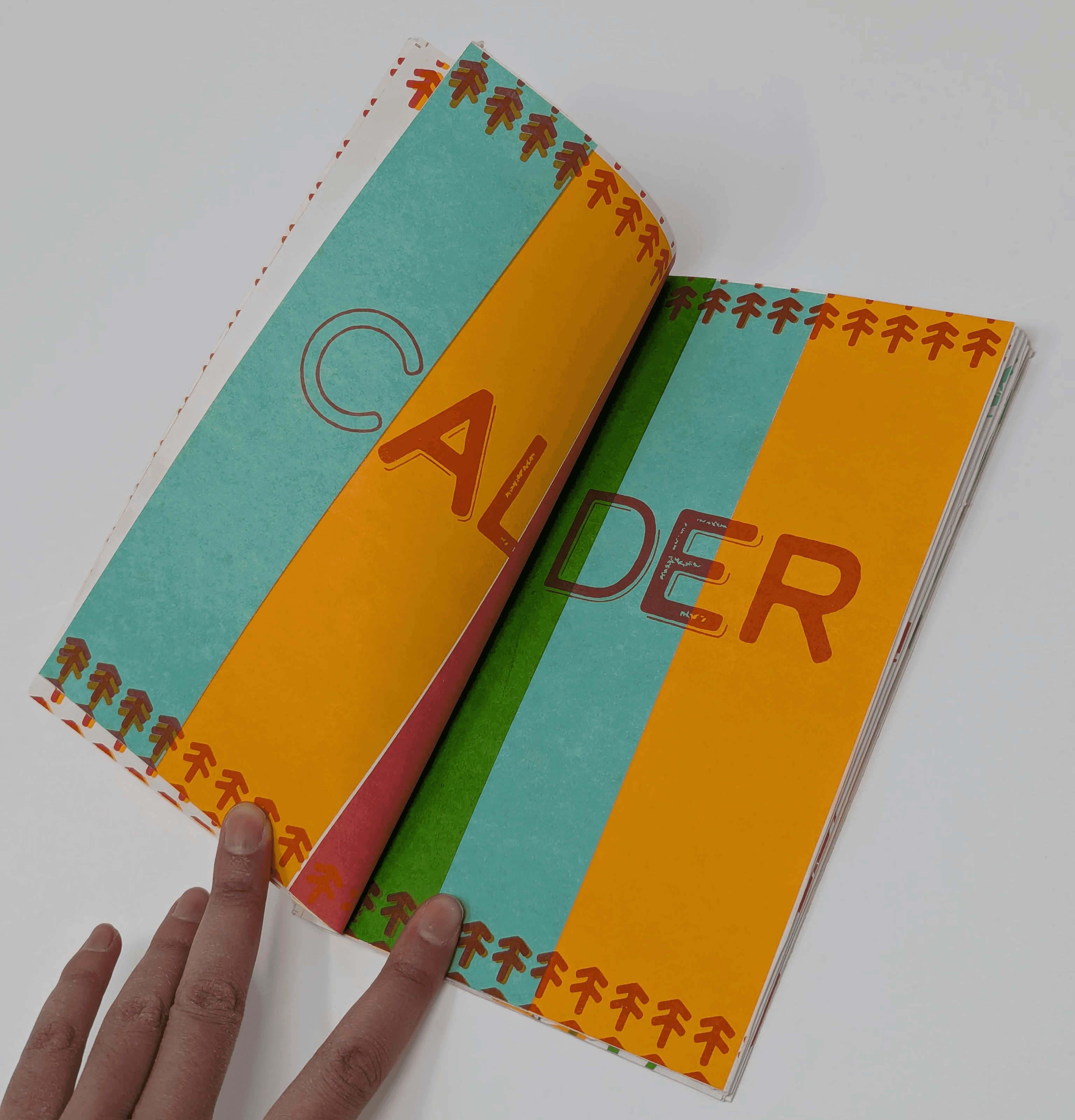 inside page, displaying the typeface "Calder" with columns of colors.