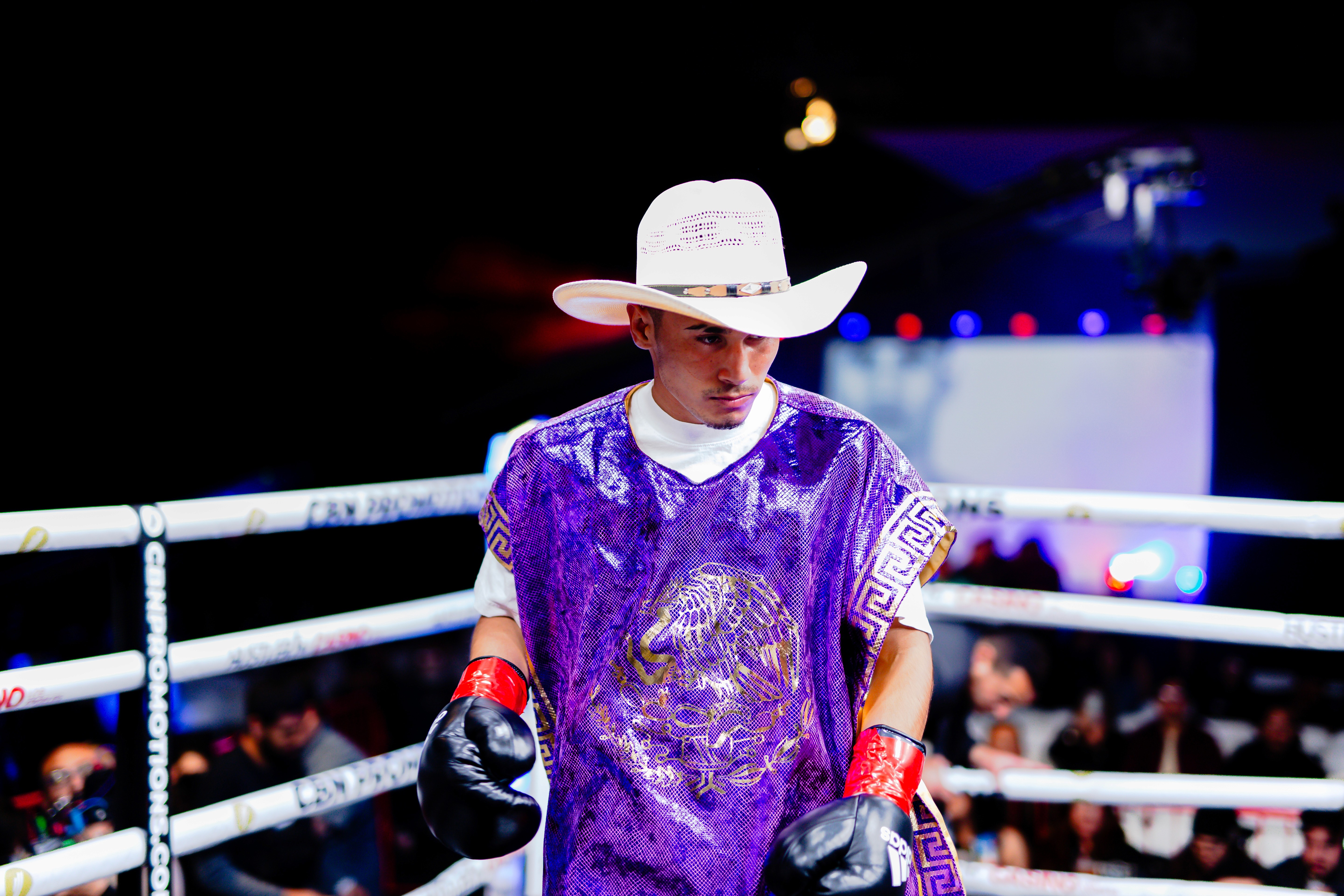 George "El Phantasma" Navarro staring toward the opponent's corner before the opening bell of a sanctioned boxing match. 
