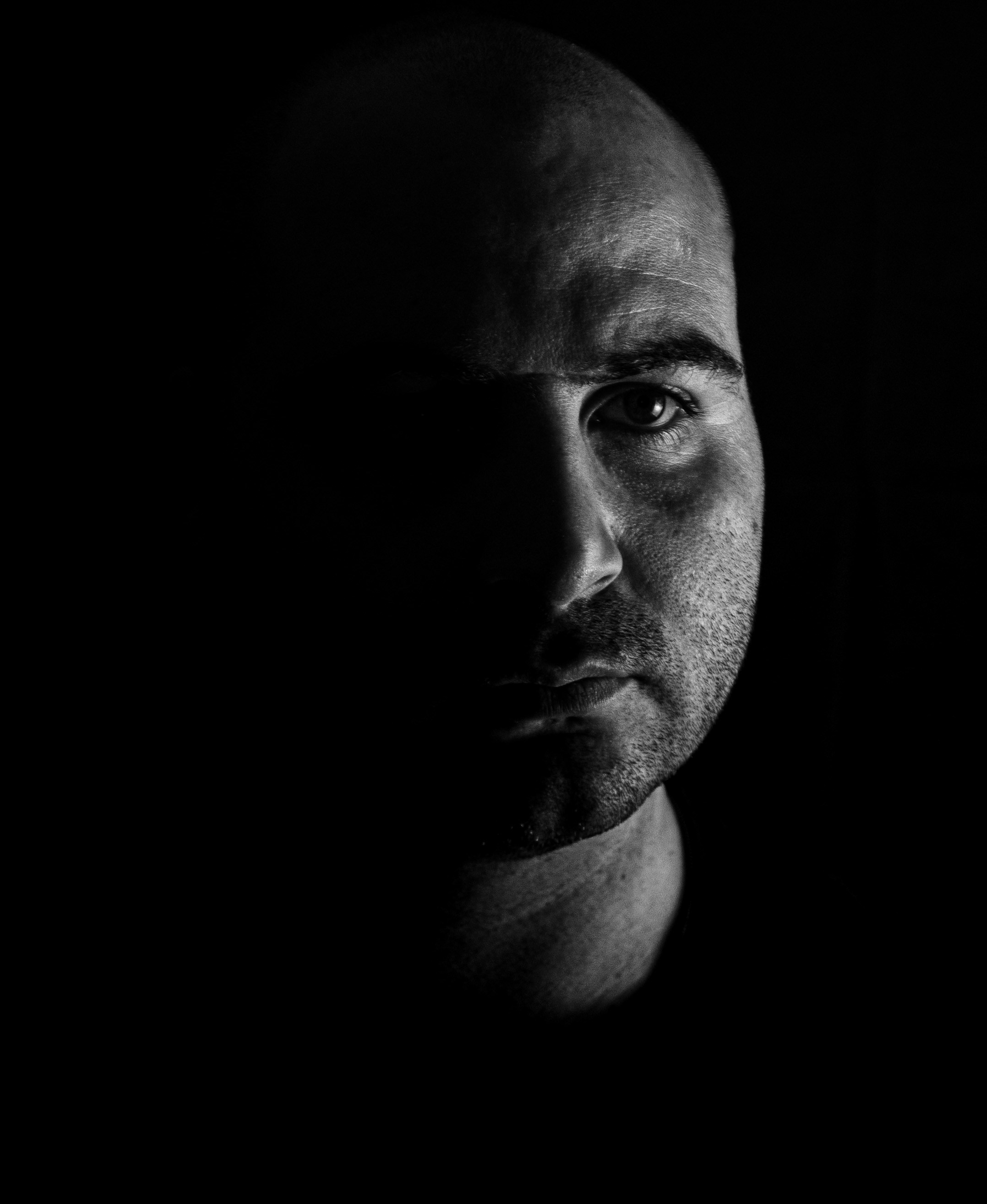 a black and white photo of a man's face