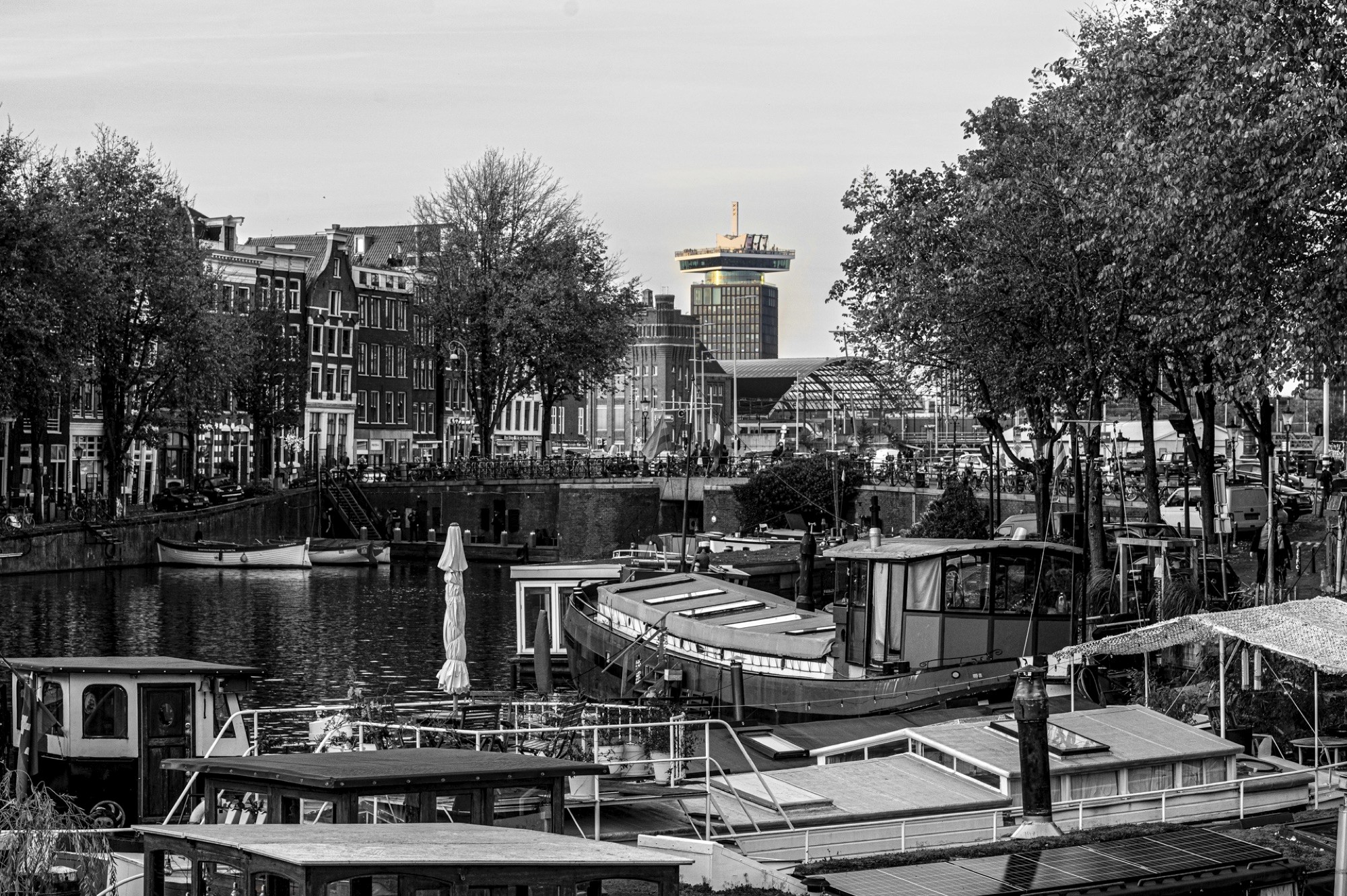 A canal boat passes under the bridges during a city experience