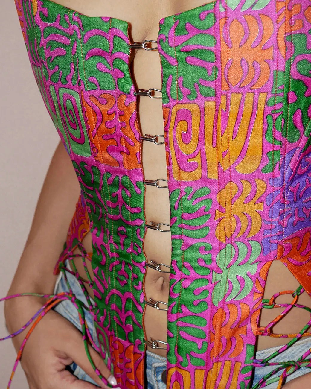RAINA is our one-of-a-kind four-panel corset, handcrafted in-house using a vintage silk saree. 
