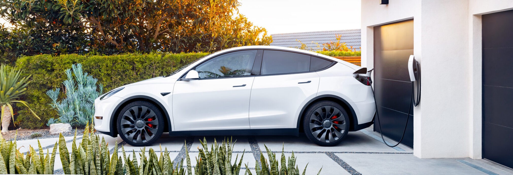 a man pumping gas into his car at a gas station