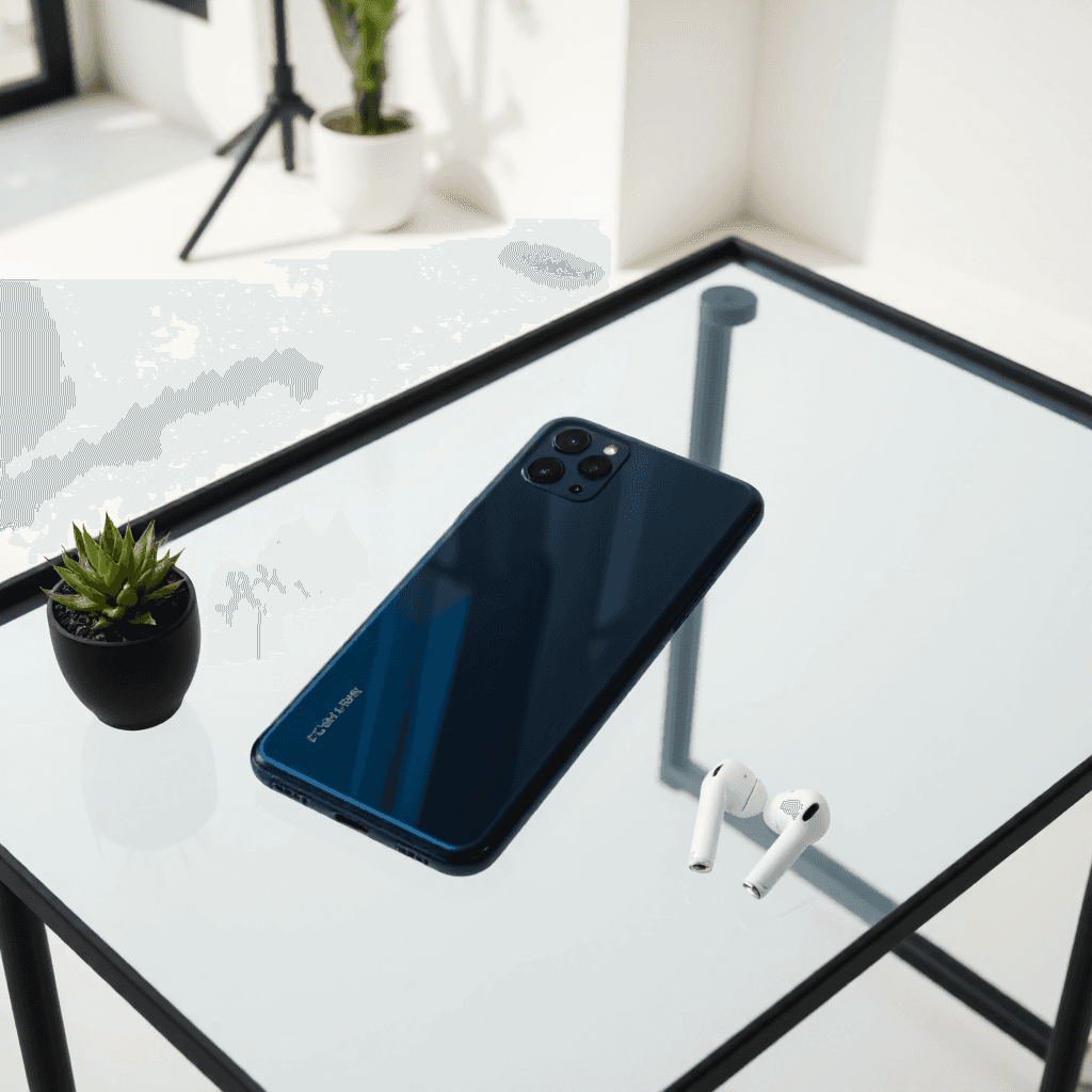 product photography of smartphone and wireless earbuds