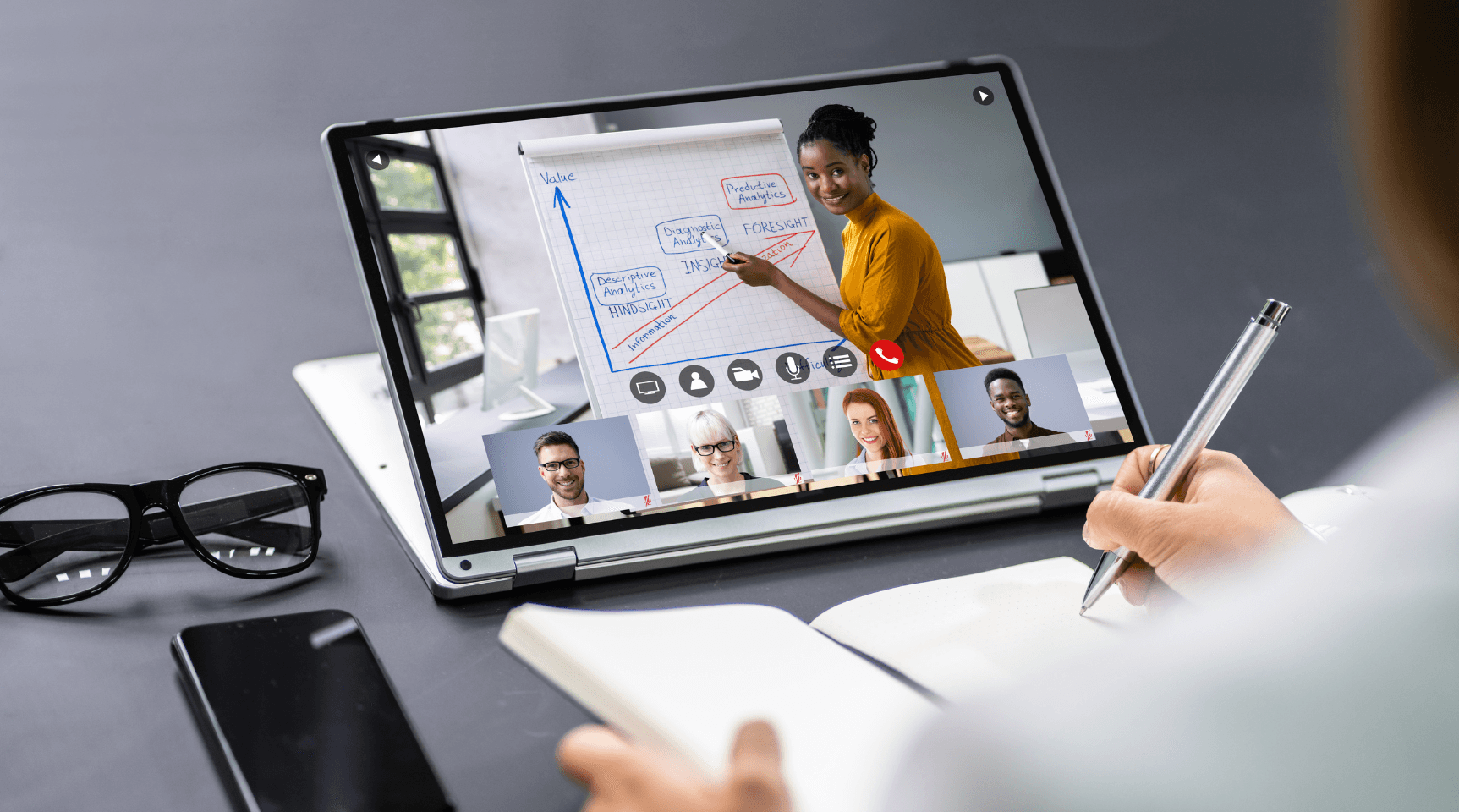 Woman taking notes from YT video - How To Summarize YouTube Videos